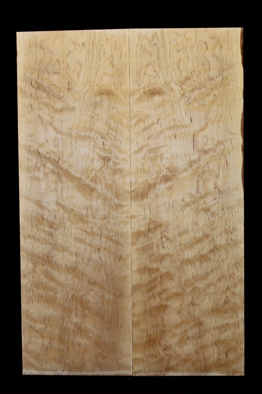 Figured eastern red maple guitar book matched top.