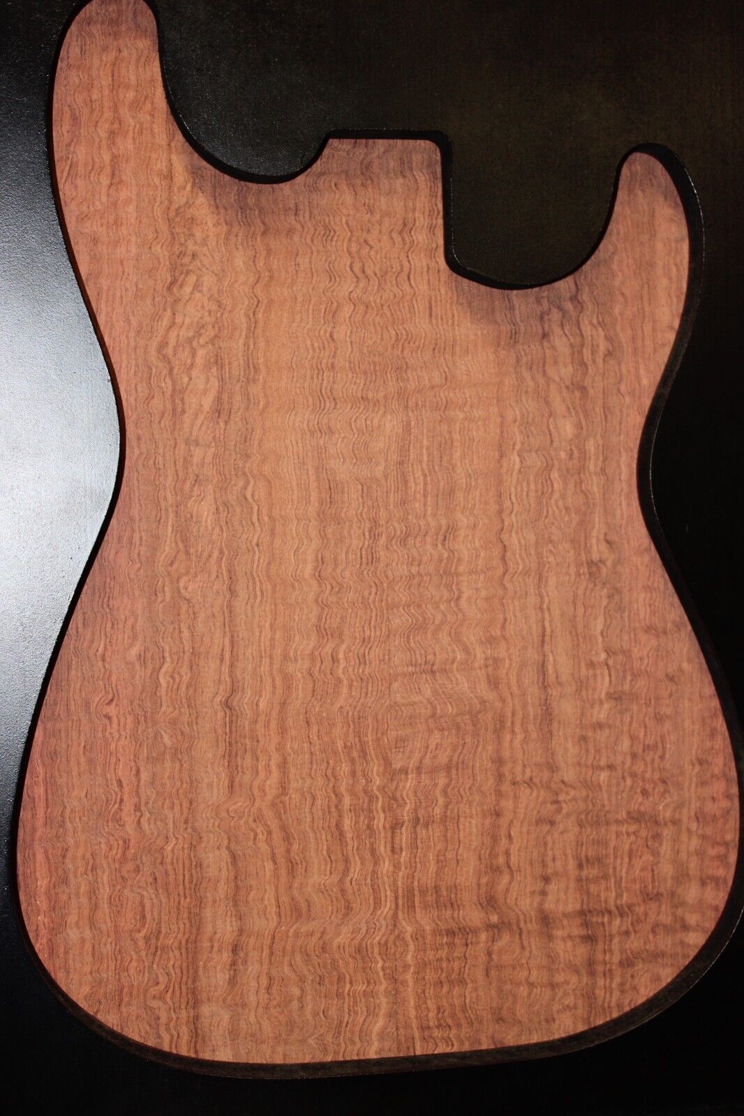 Figured bubinga electric guitar drop top. Curly / pomelle figure & rich color.