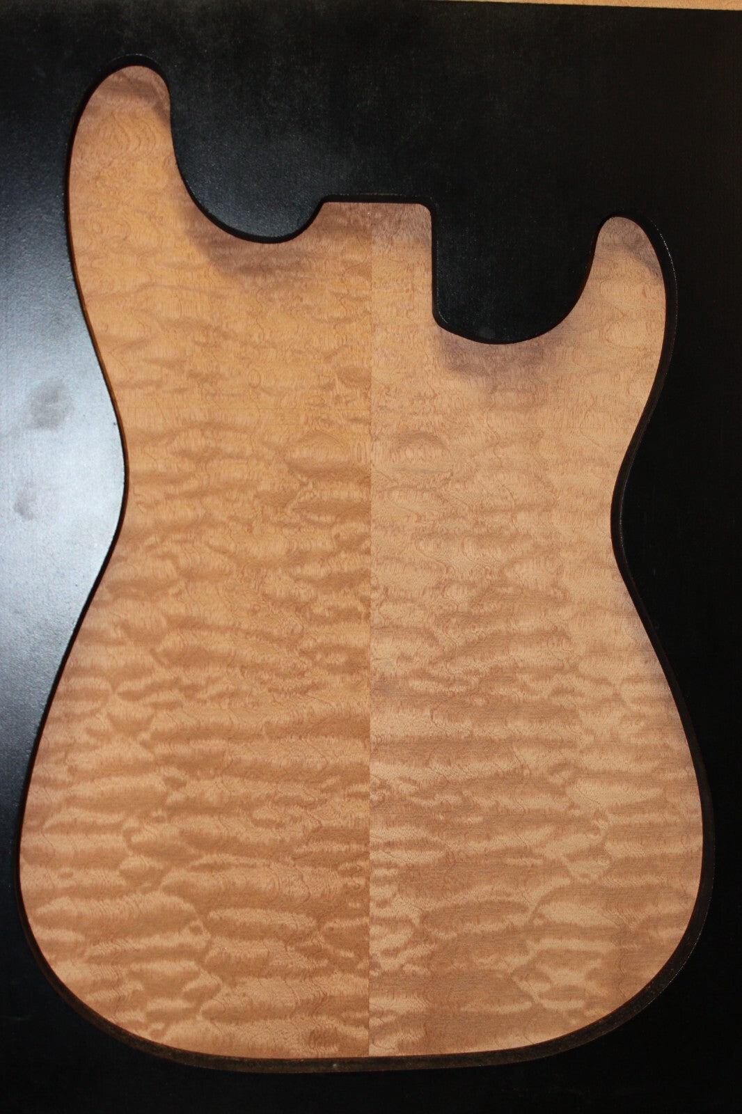 Quilted sapele electric guitar bookmatched drop top. Master grade figure.