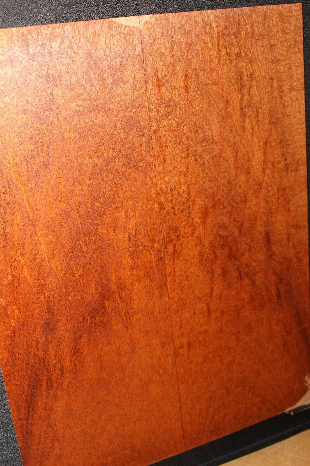 Figured genuine mahogany bookmatched electric guitar drop top.