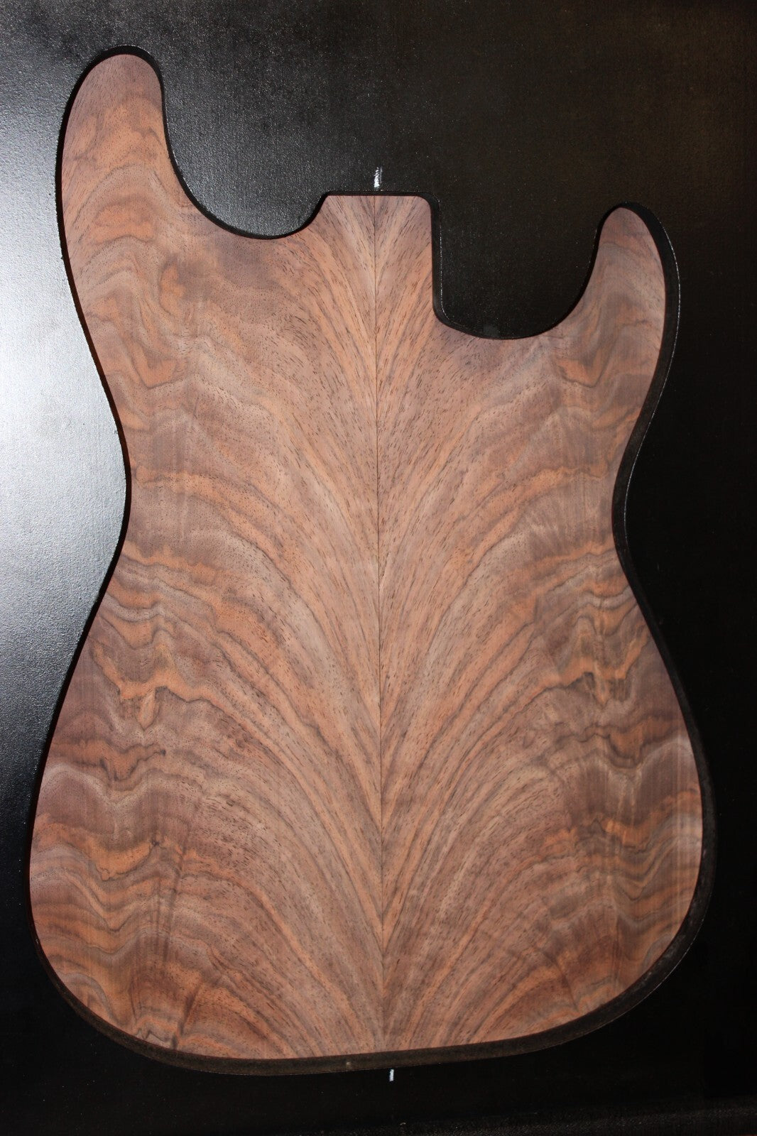 Black walnut crotch figured book matched guitar top.