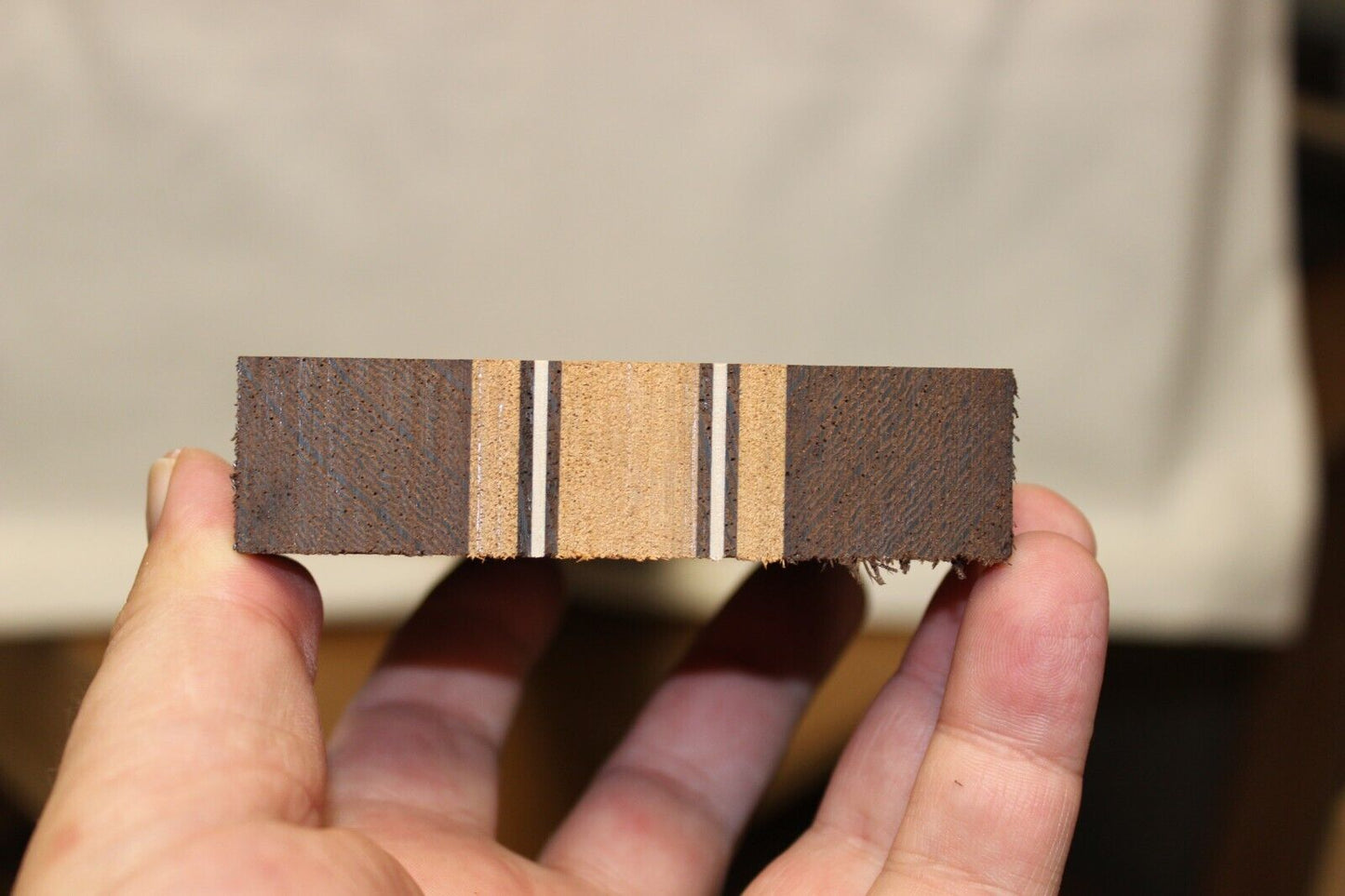 Figured mahogany, wenge and hard maple laminated guitar neck blank.