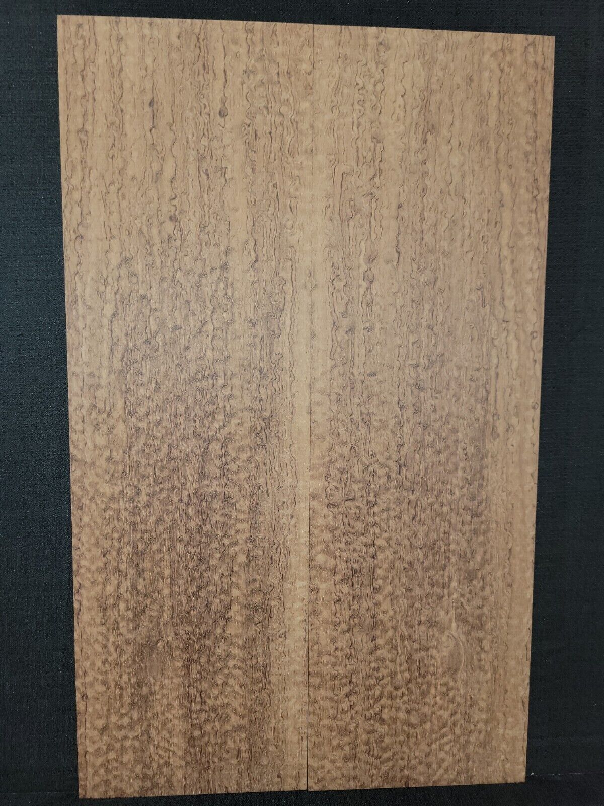 Pomelle figured bubinga electric guitar drop top.
