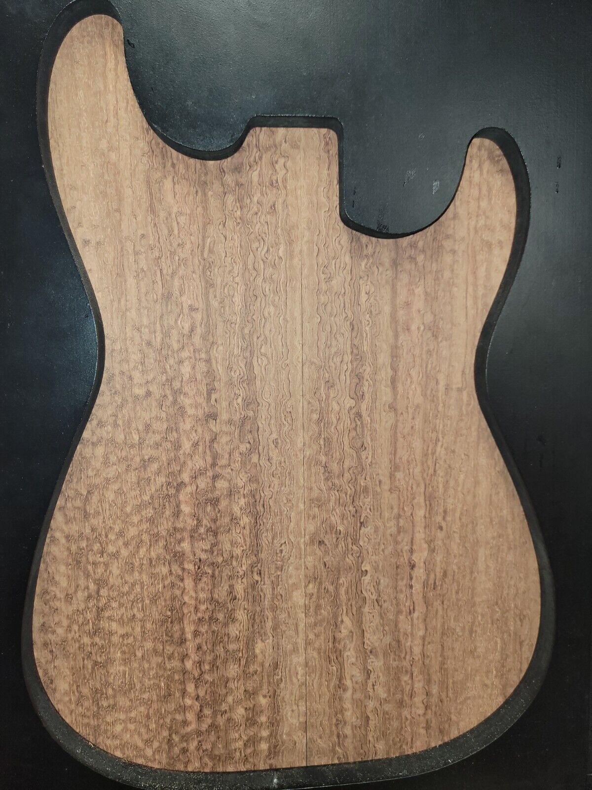 Pomelle figured bubinga electric guitar drop top.