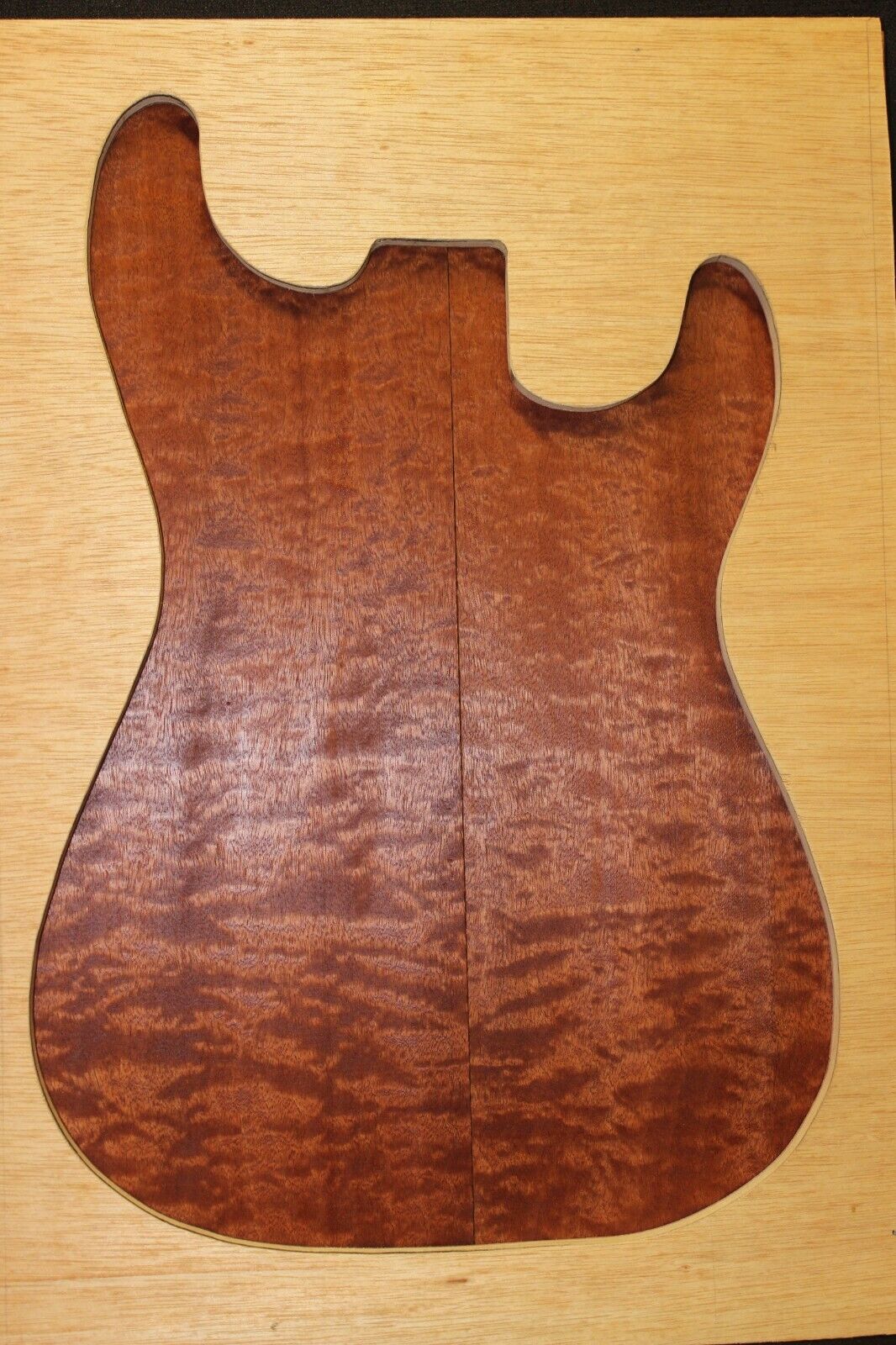 Quilted figured sapele guitar bookmatched drop top.