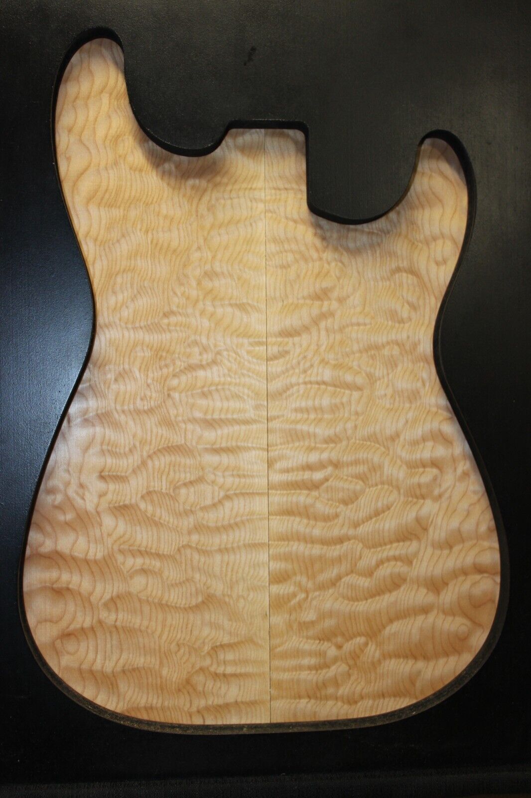 Quilted maple book matched guitar drop top.
