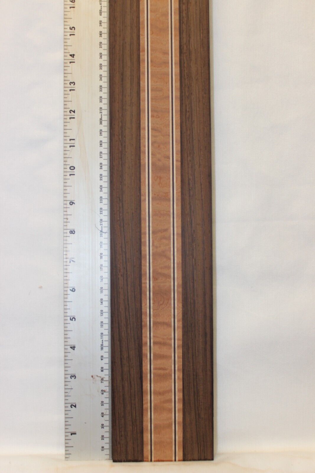 Quilted sapele, wenge and flame maple laminated guitar neck blank.