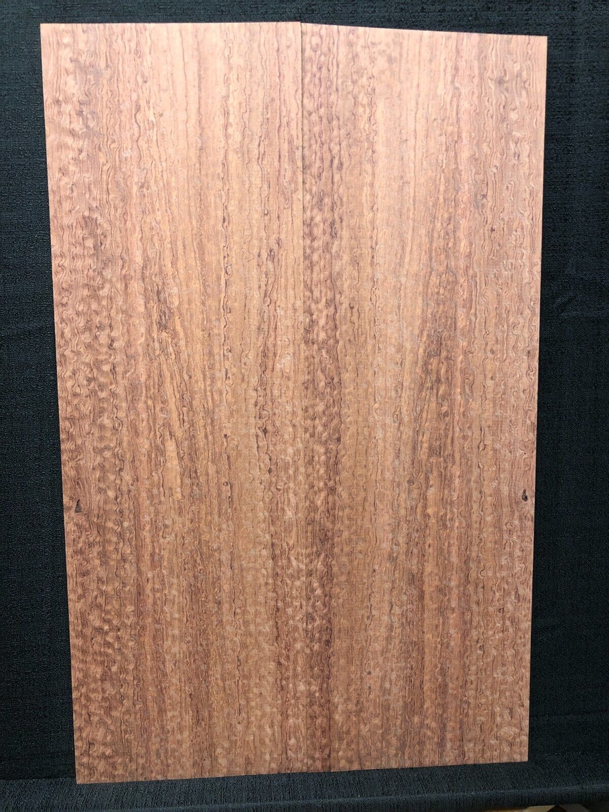 Pomelle figured bubinga electric guitar drop top.