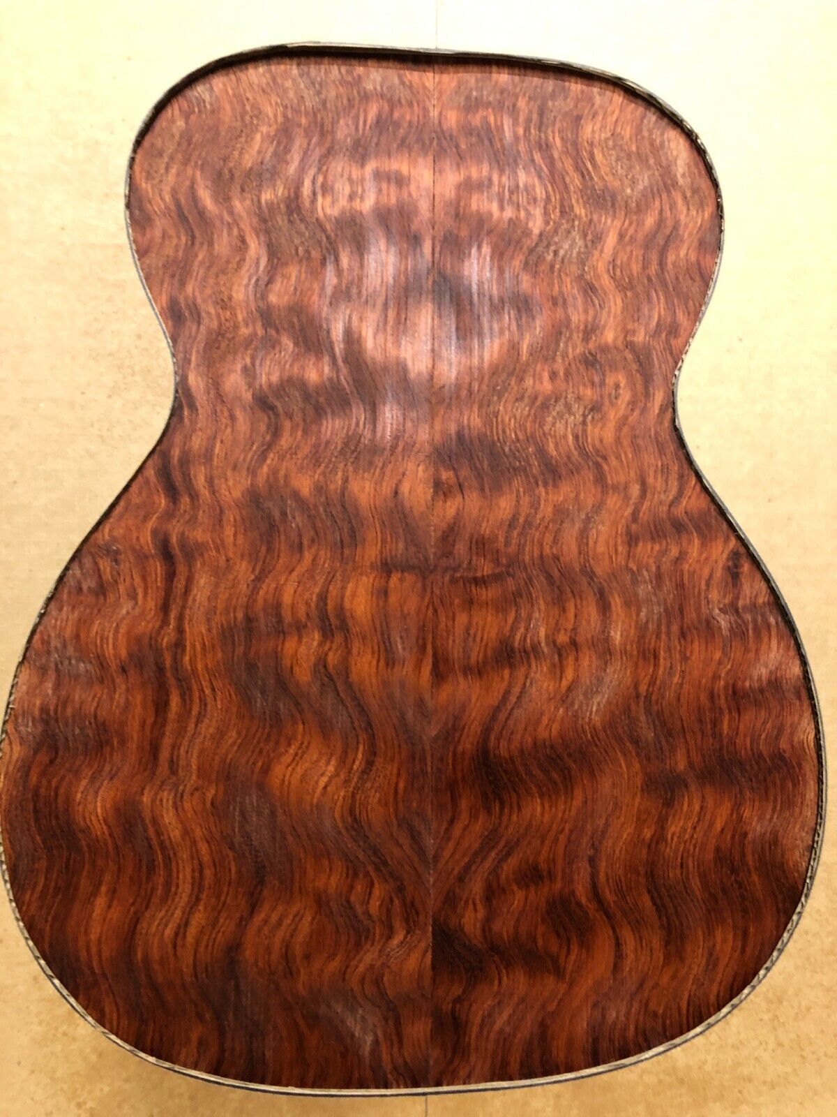 Waterfall figured bubinga back and side set. Stunning grain, color and figure.