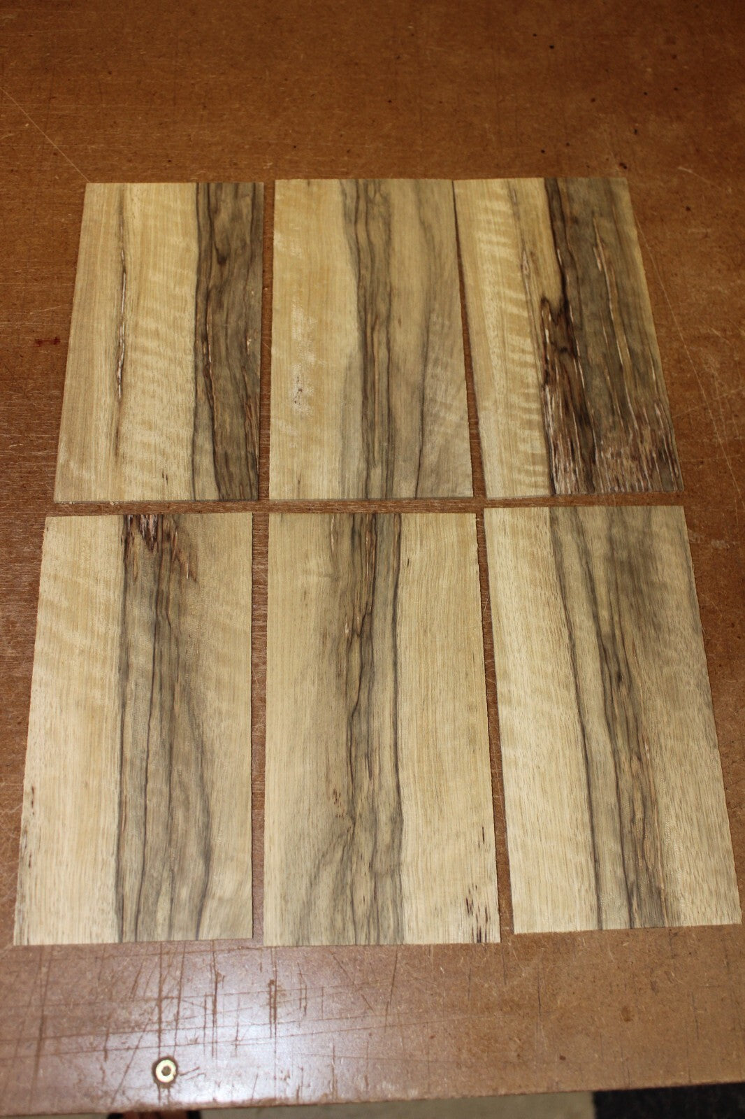 Quarter sawn, figured black limba headstock / peg head veneer. Sold individually