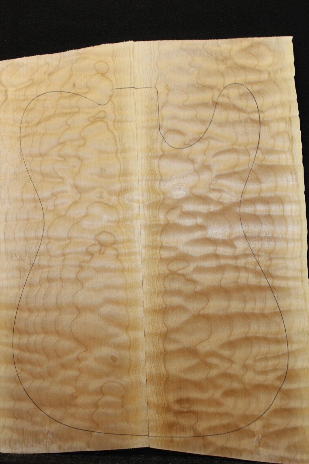 Quilted maple book matched guitar drop top. 5A figure, telly size