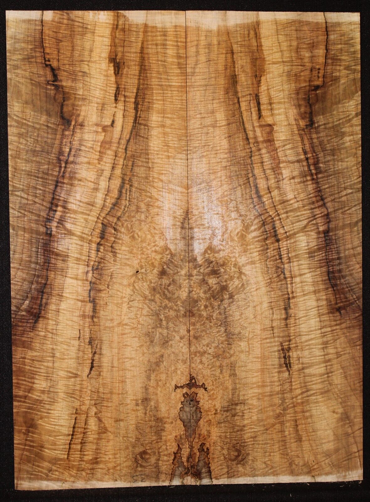 Figured ambrosia maple book matched guitar top, insane figure and color.