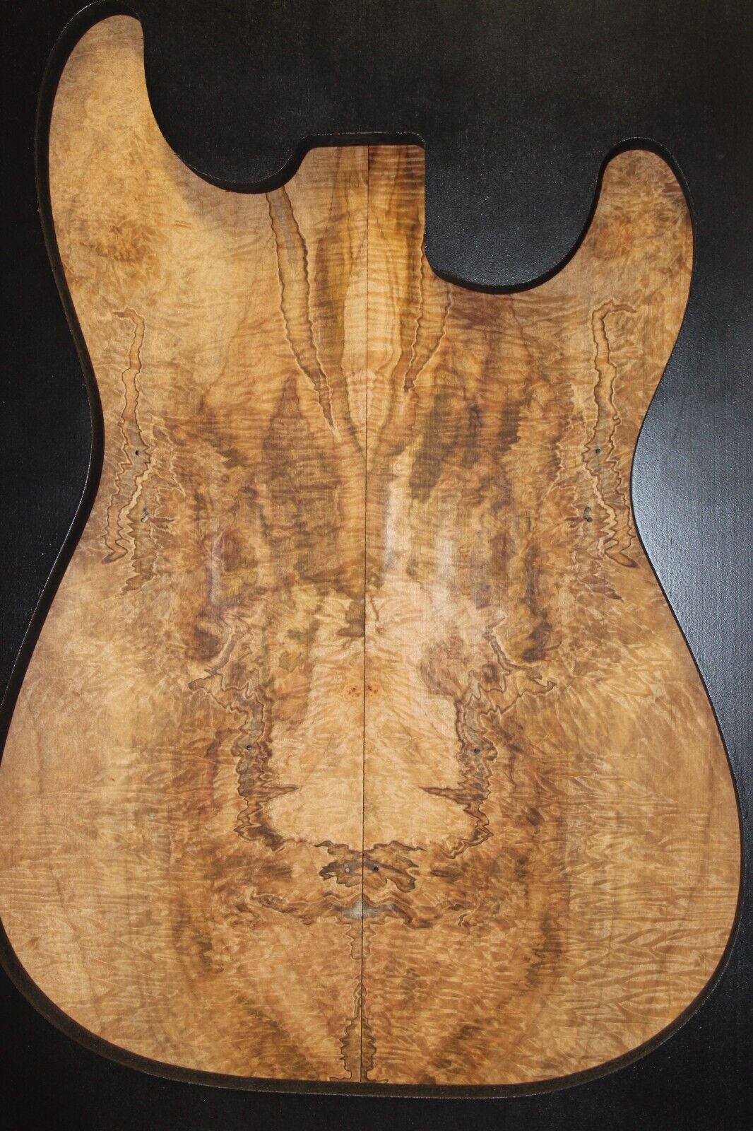 Figured ambrosia maple bookmatched guitar top, insane figure and color.