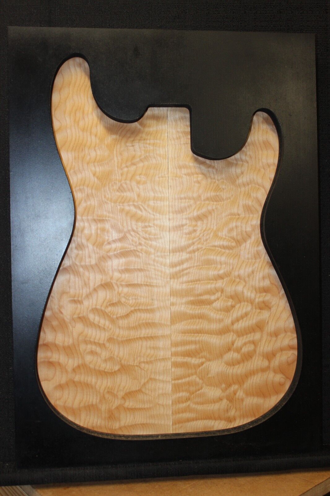 Quilted maple book matched guitar drop top.