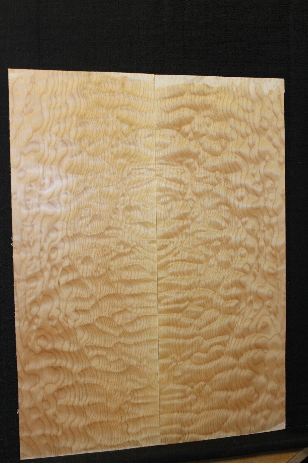 Quilted maple book matched guitar drop top.