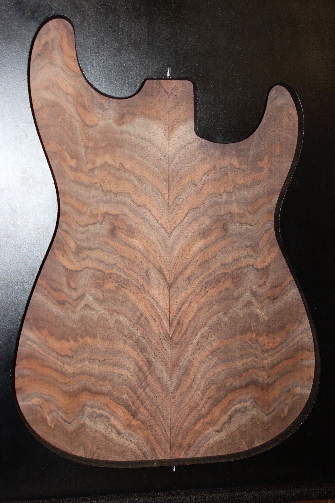 Black walnut crotch figured book matched guitar top.
