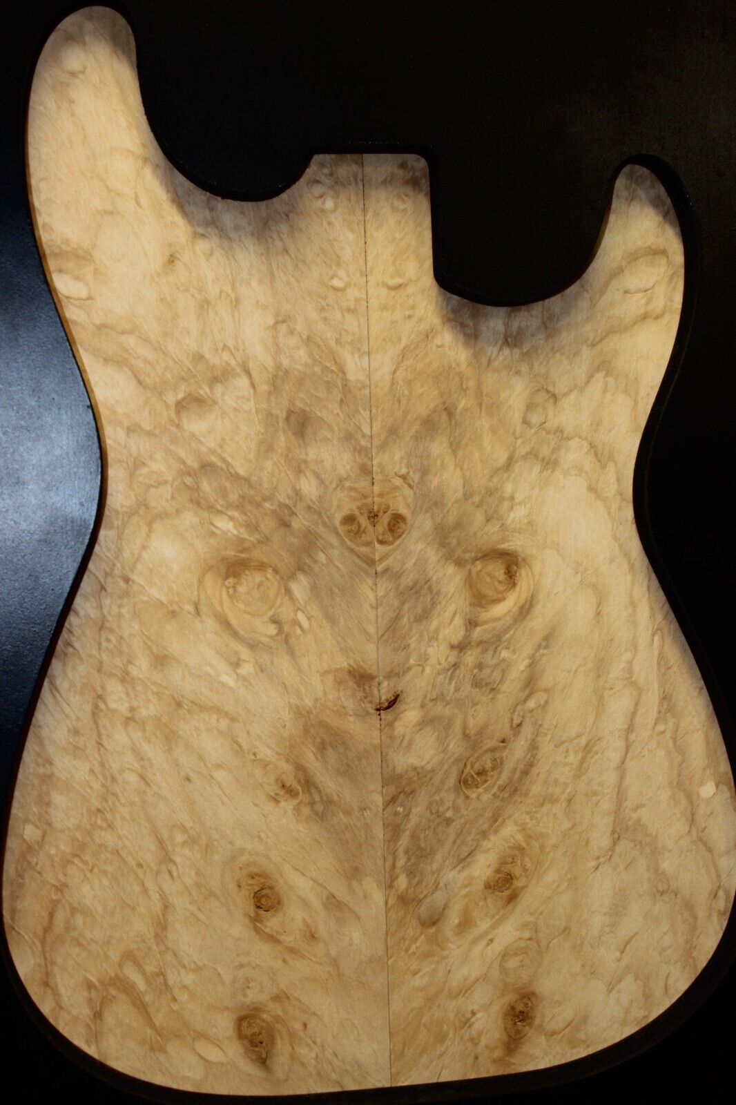 Silver maple, burl / lace figured guitar book matched top.