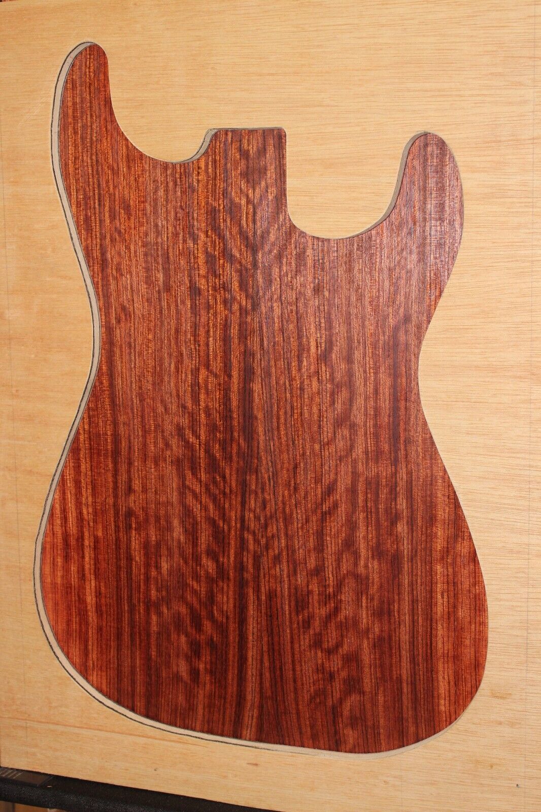 Figured quarter sawn bubinga guitar drop top.
