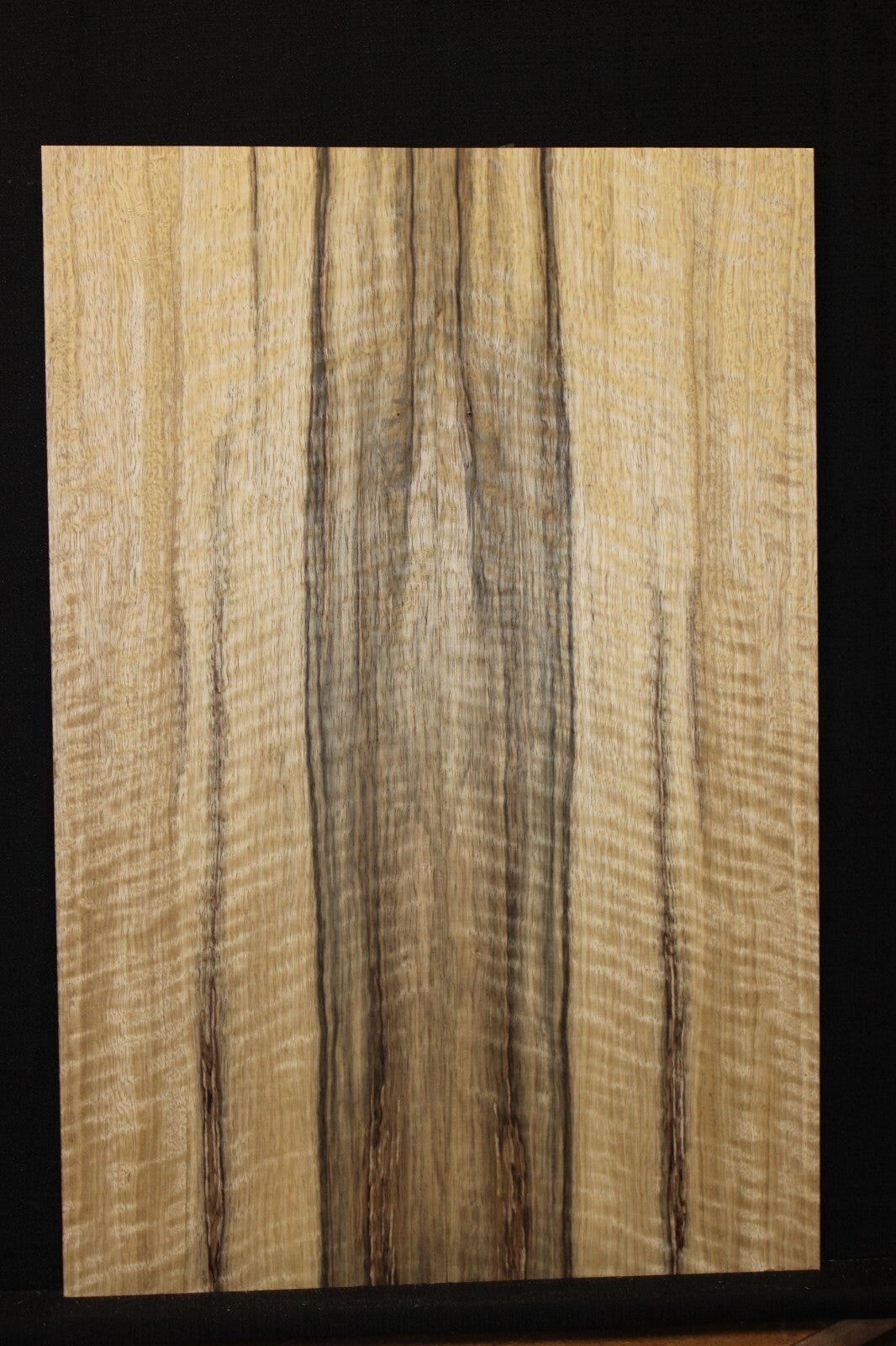 Curly black limba / korina figured book matched guitar top. 0.37" thick