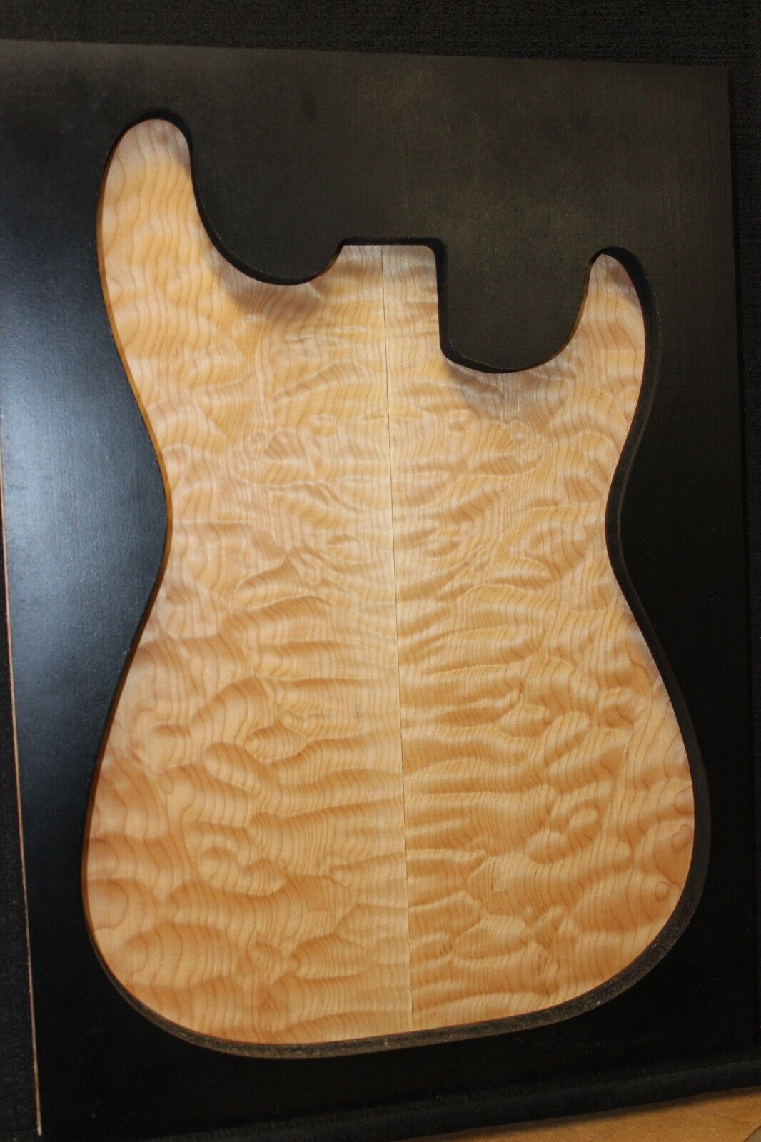 Quilted maple book matched guitar drop top.