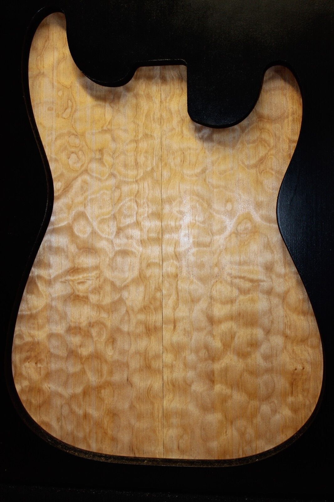 Quilted maple book matched guitar drop top.