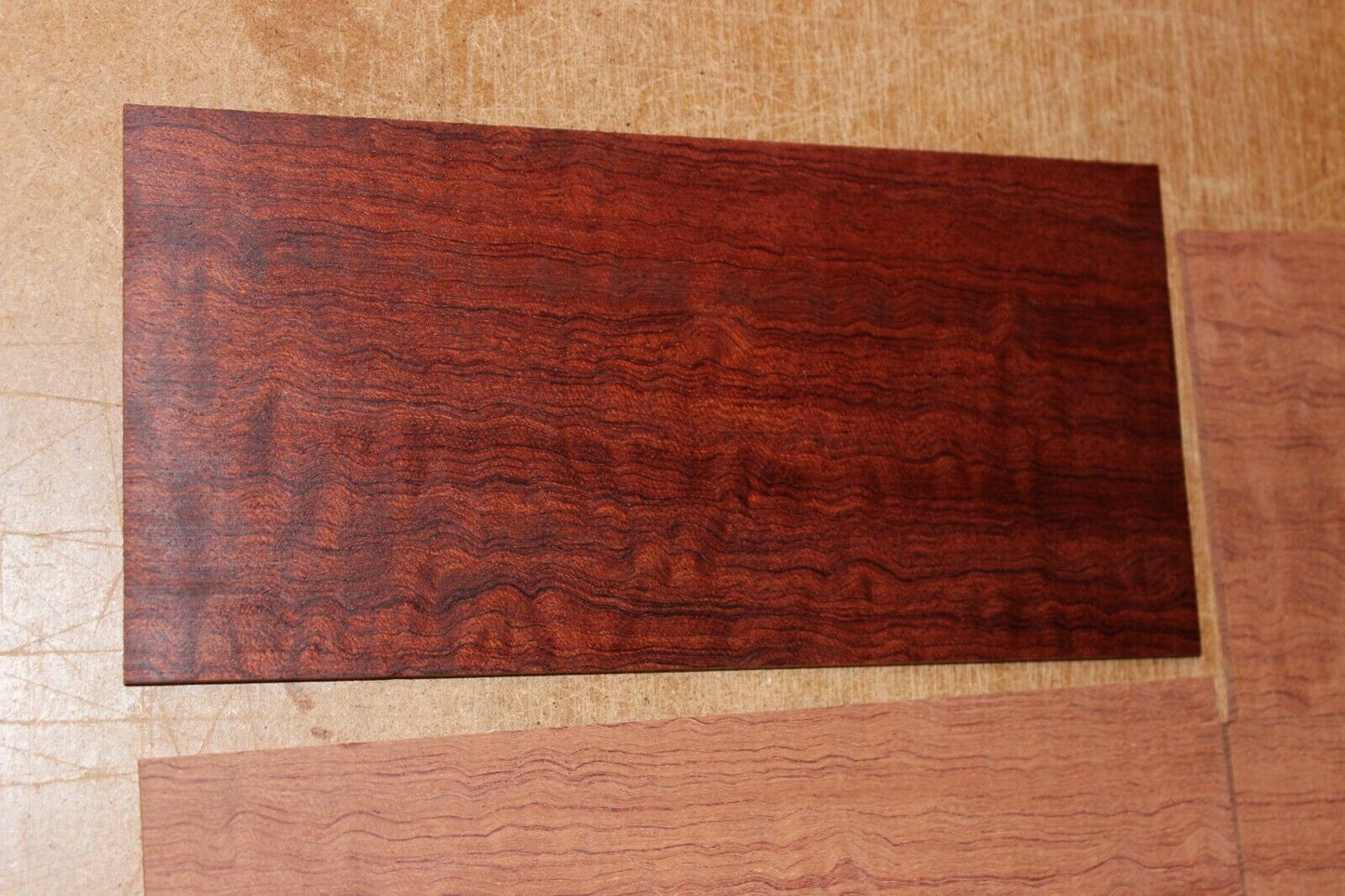 Quarter sawn figured bubinga headstock / peg head veneer. Sold individually