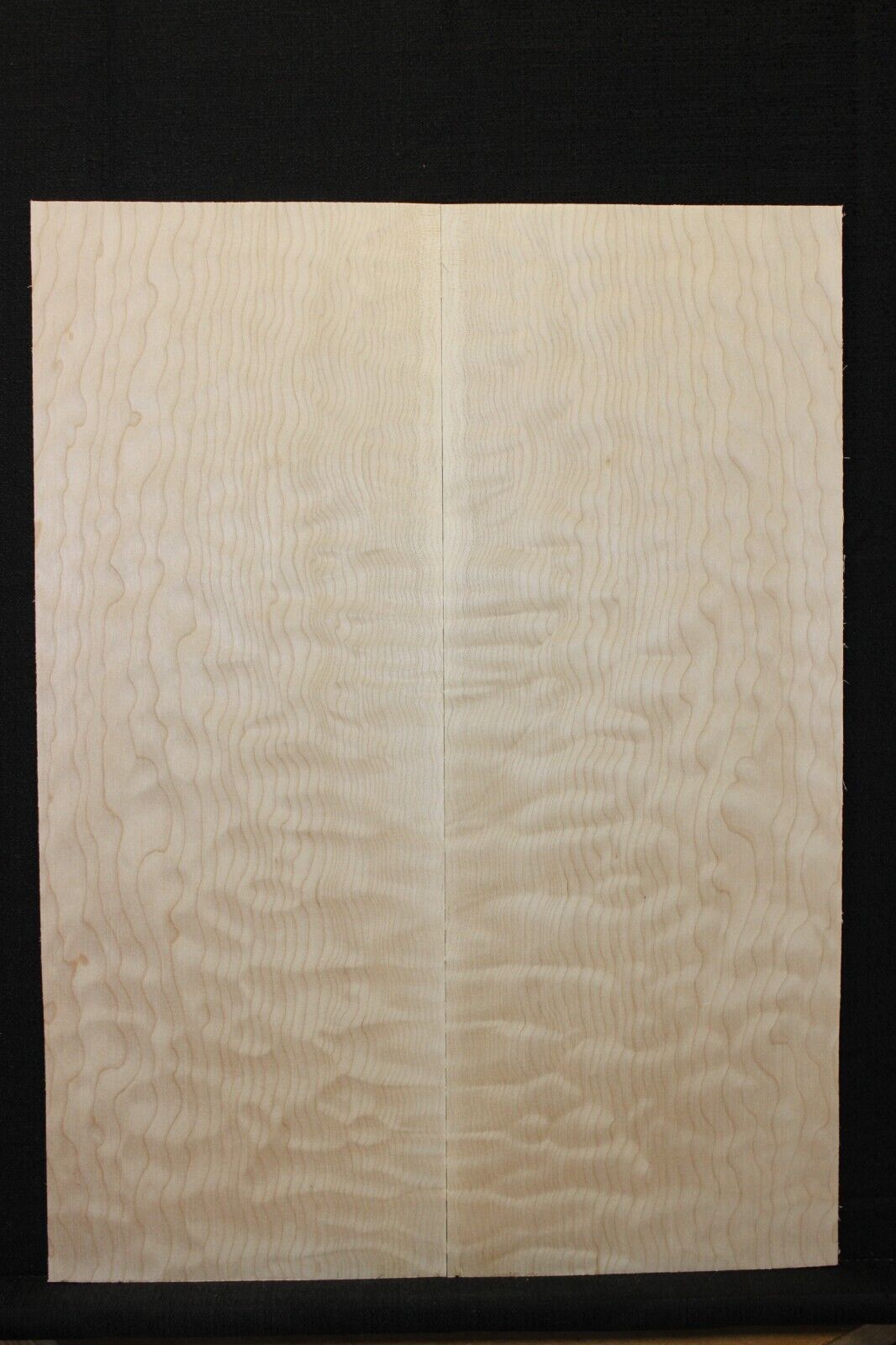 Quilted maple book matched guitar drop top.