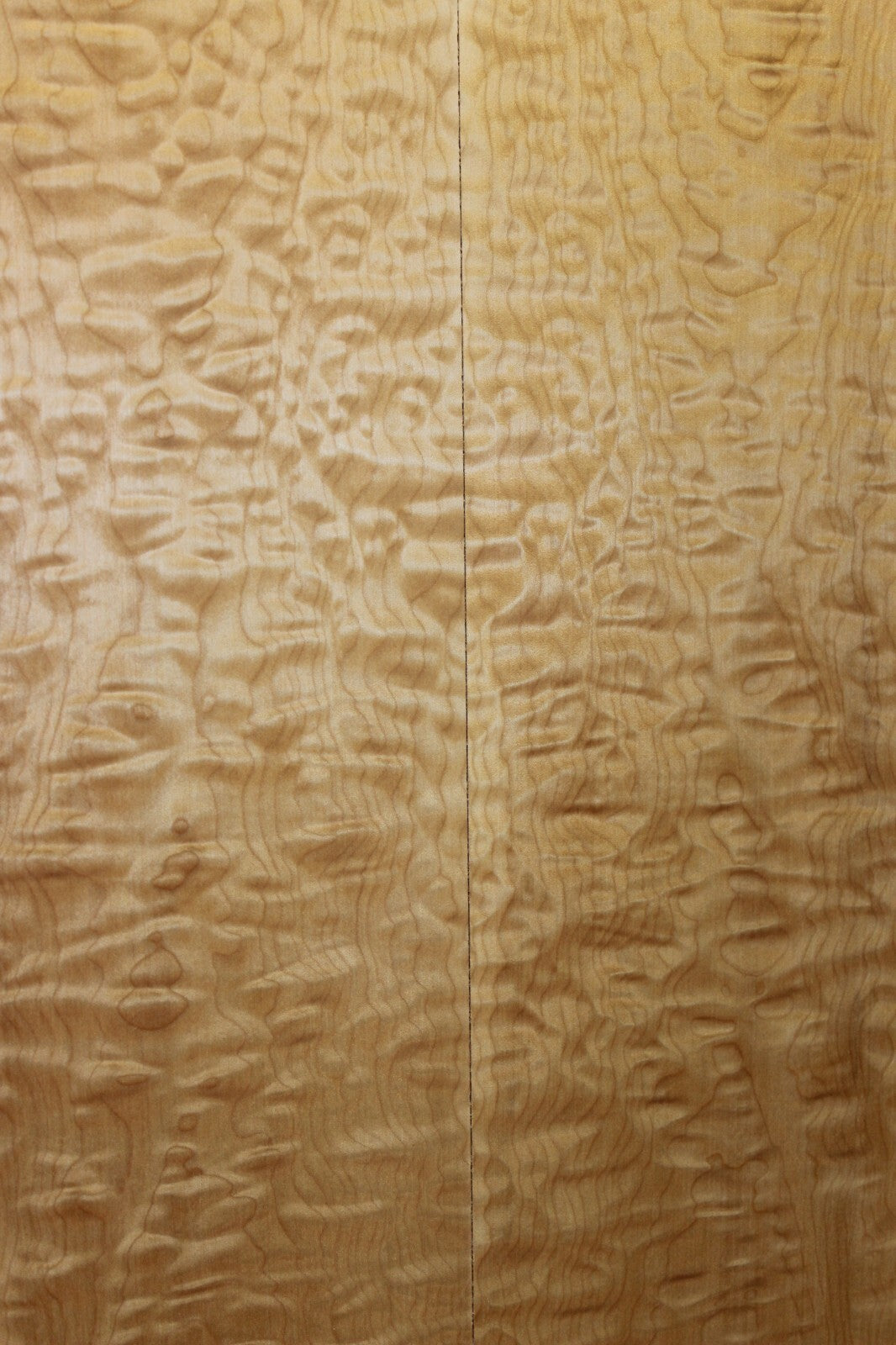 Quilted maple book matched guitar drop top.