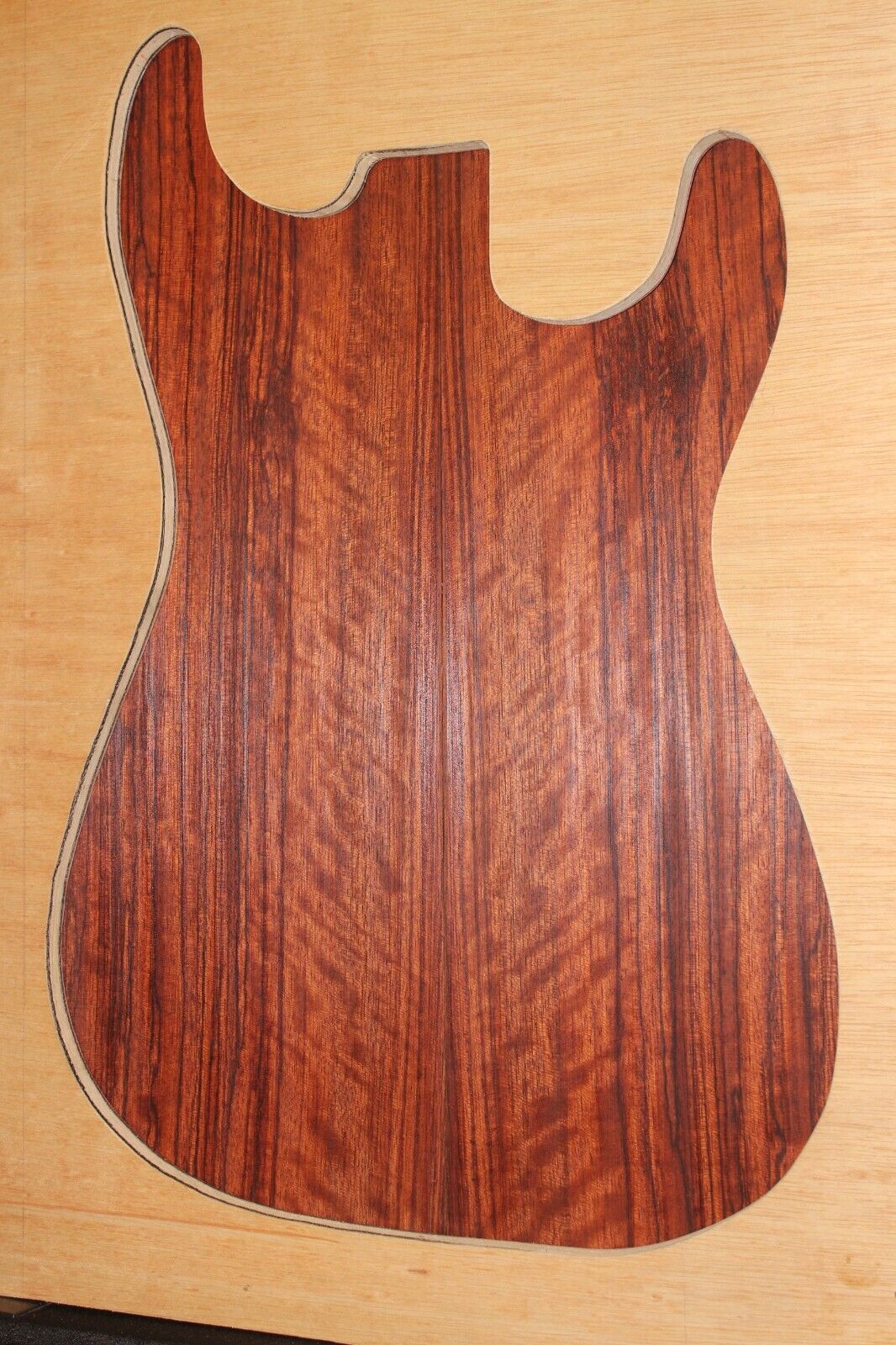 Figured quarter sawn bubinga guitar drop top.