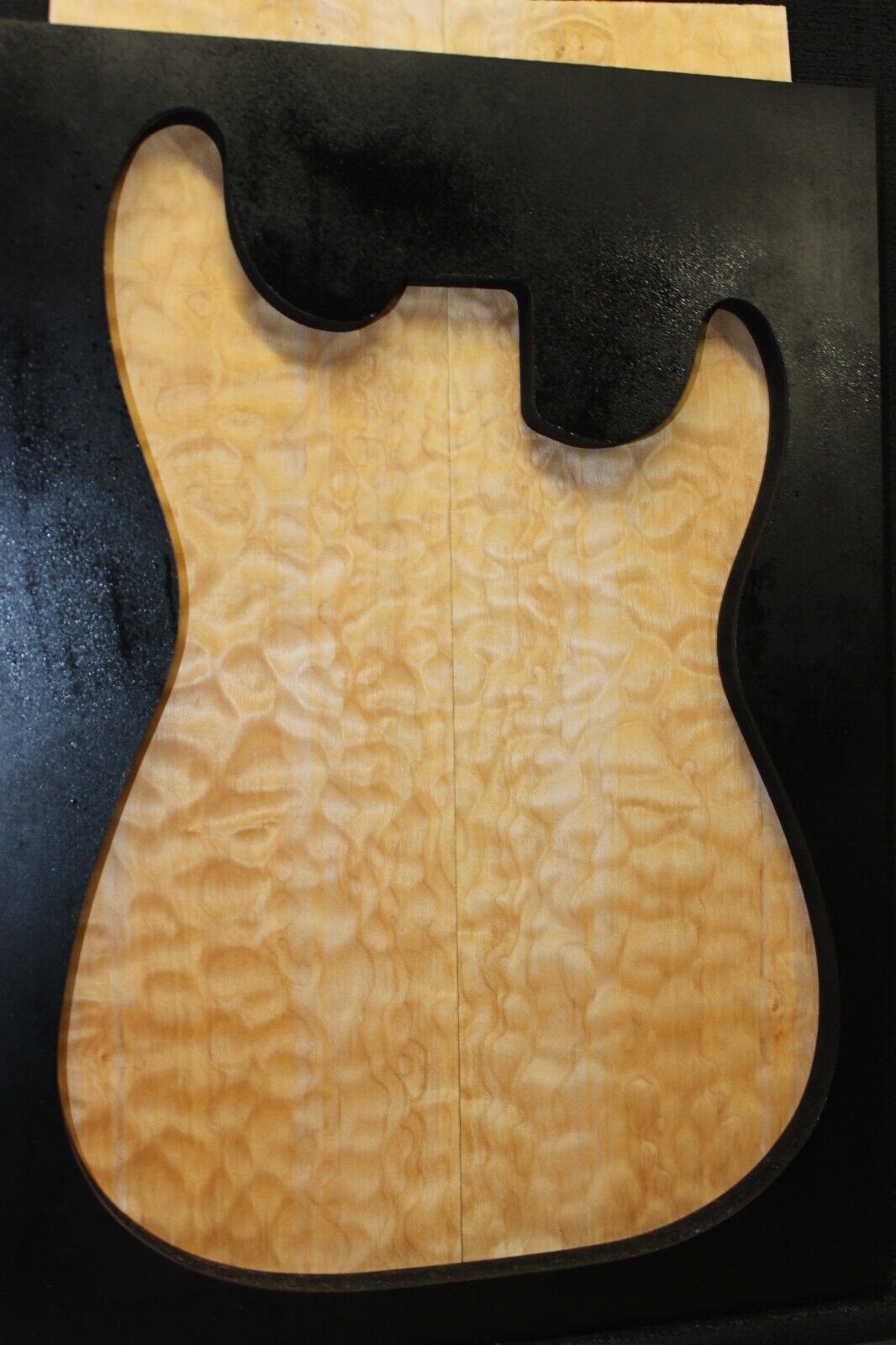 Quilted maple book matched guitar drop top.