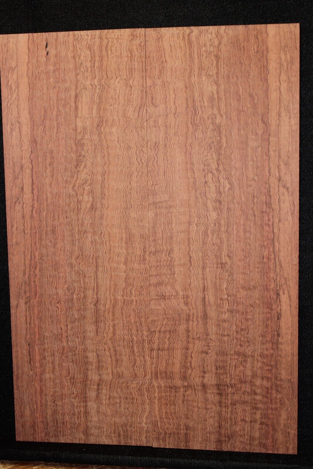 Figured bubinga electric guitar drop top. Curly / pomelle figure & rich color.