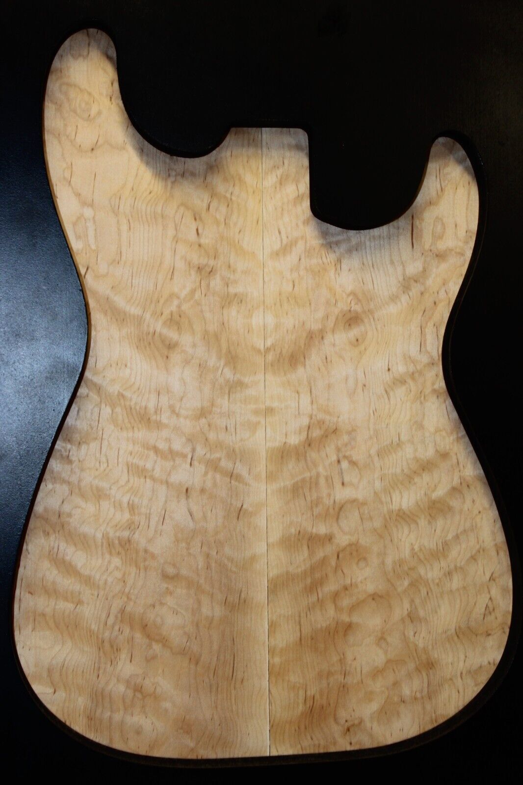 Figured eastern red maple guitar book matched top.