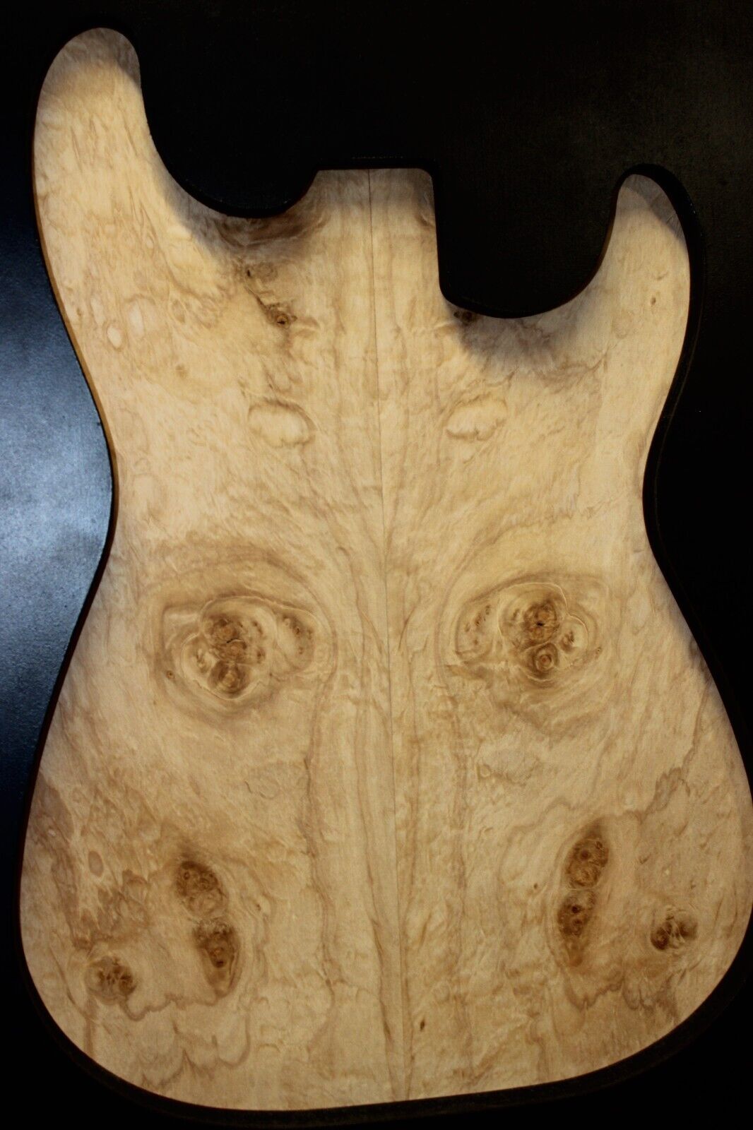 Silver maple, burl / lace figured guitar book matched top.