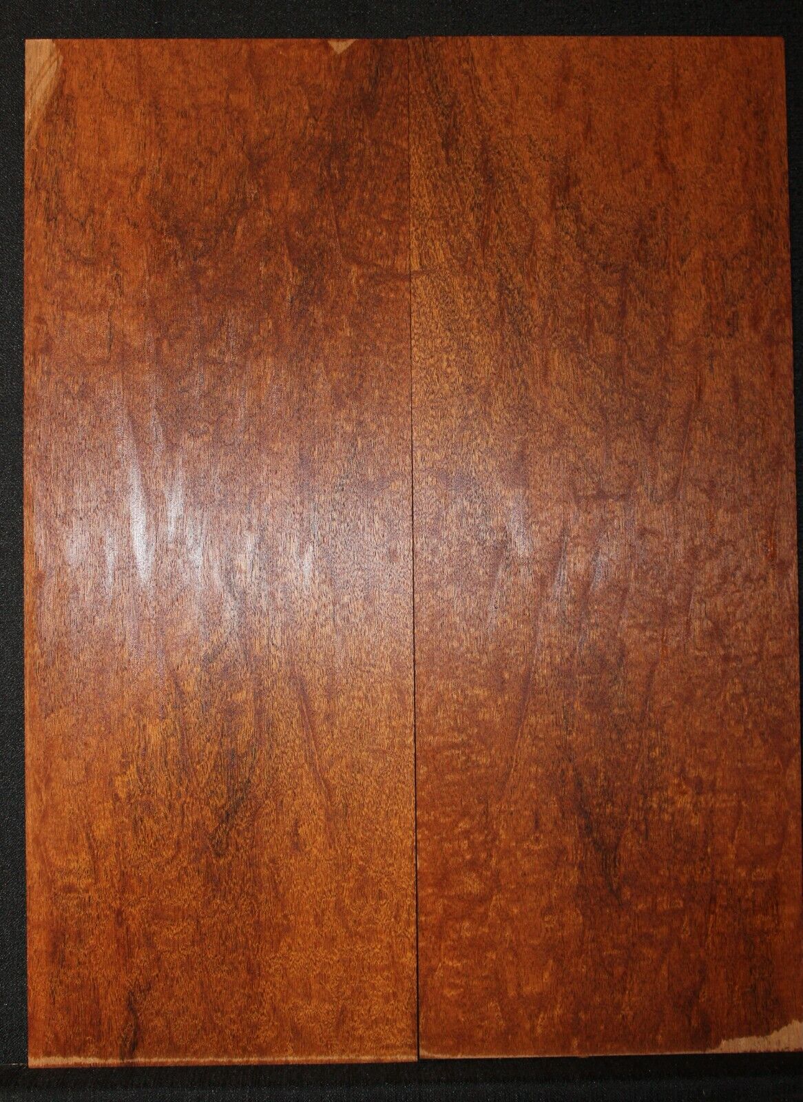 Figured genuine mahogany bookmatched electric guitar drop top.