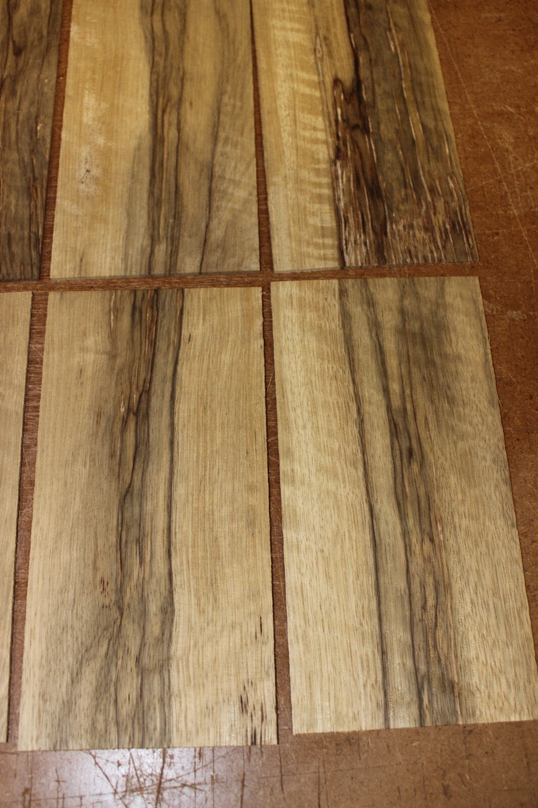 Quarter sawn, figured black limba headstock / peg head veneer. Sold individually