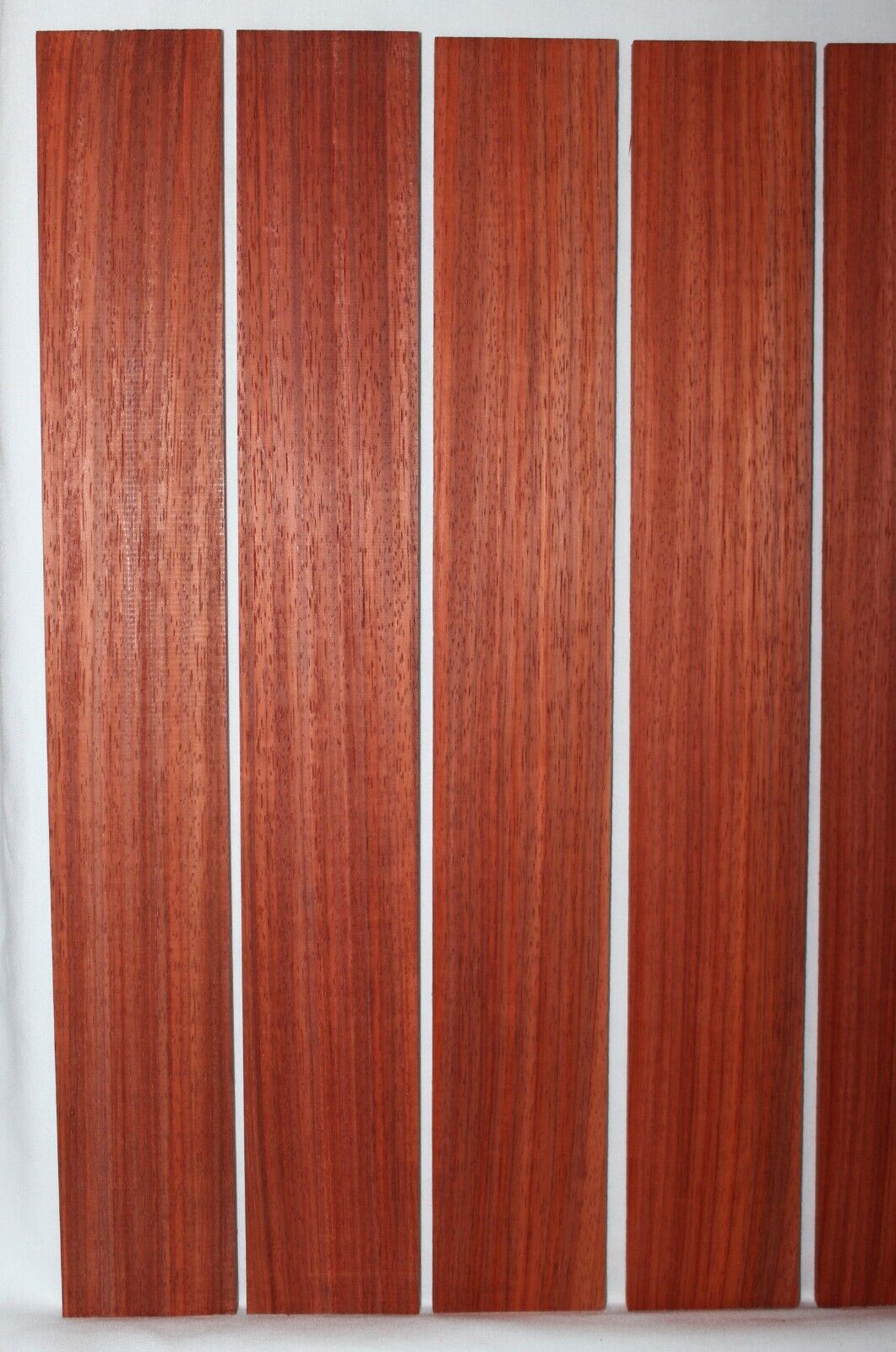 Padauk fingerboard blank, quarter sawn 22 X 3 X 0.32 minimum. Sold individually