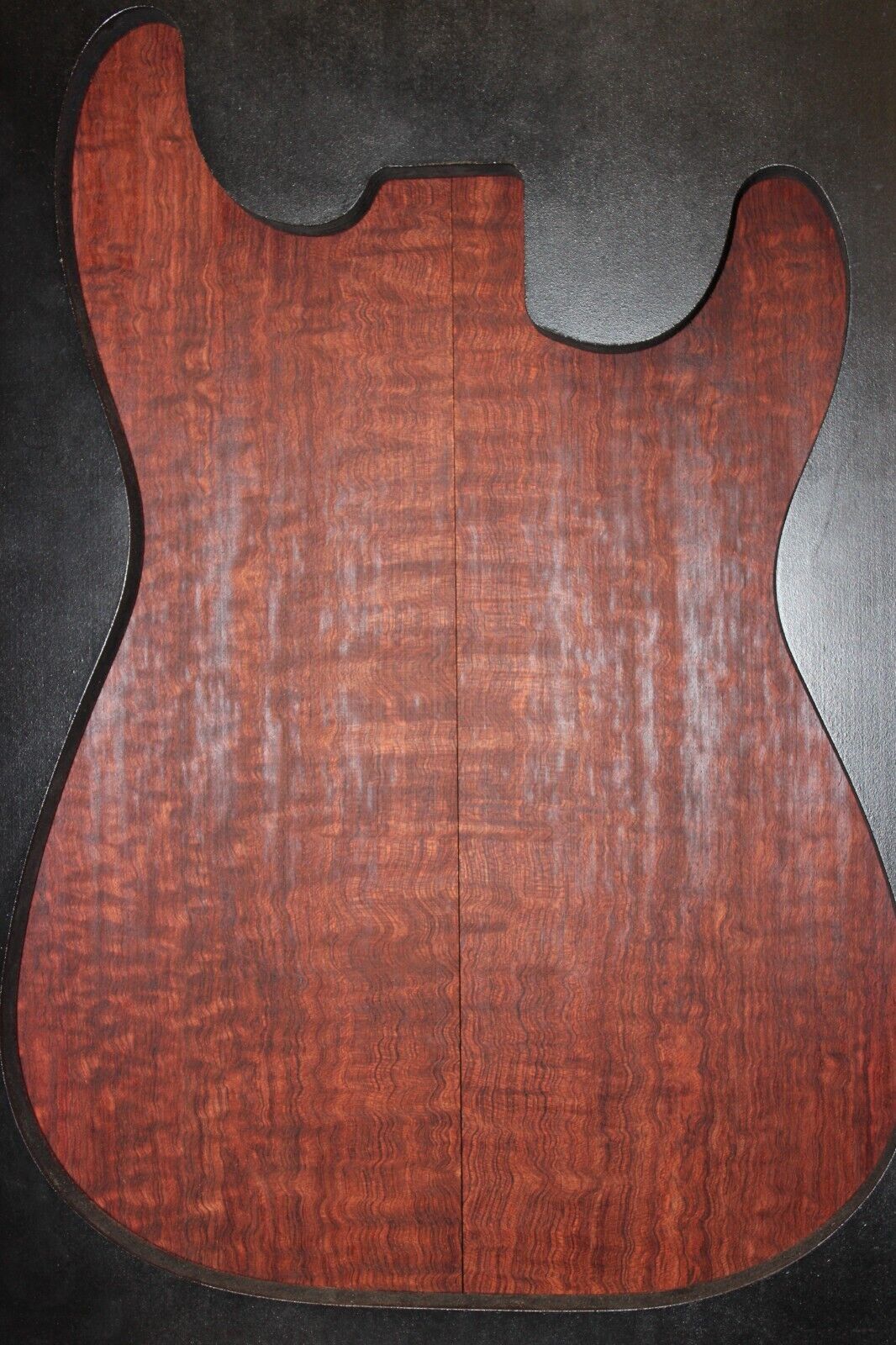 Figured bubinga electric guitar drop top. Curly / pomelle figure & rich color.