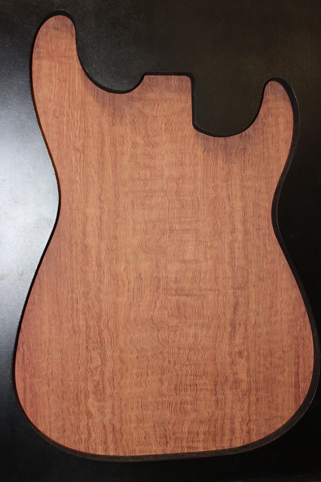Figured bubinga electric guitar drop top. Curly / pomelle figure & rich color.