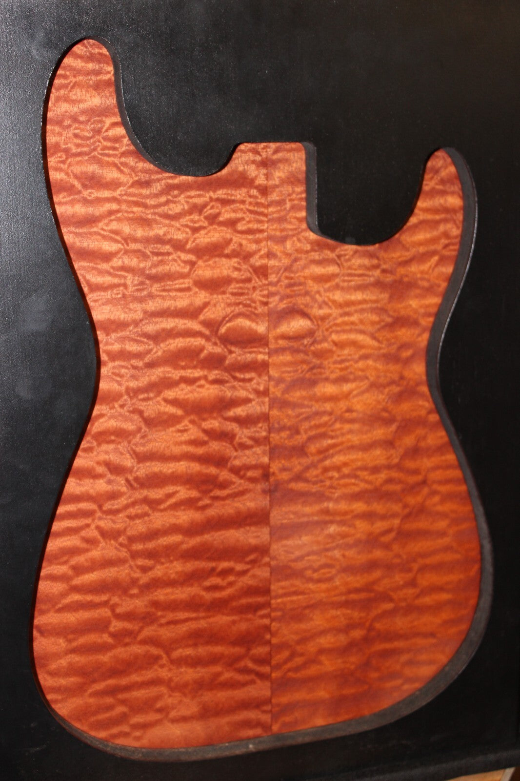 Quilted sapele electric guitar bookmatched drop top. Master grade figure.