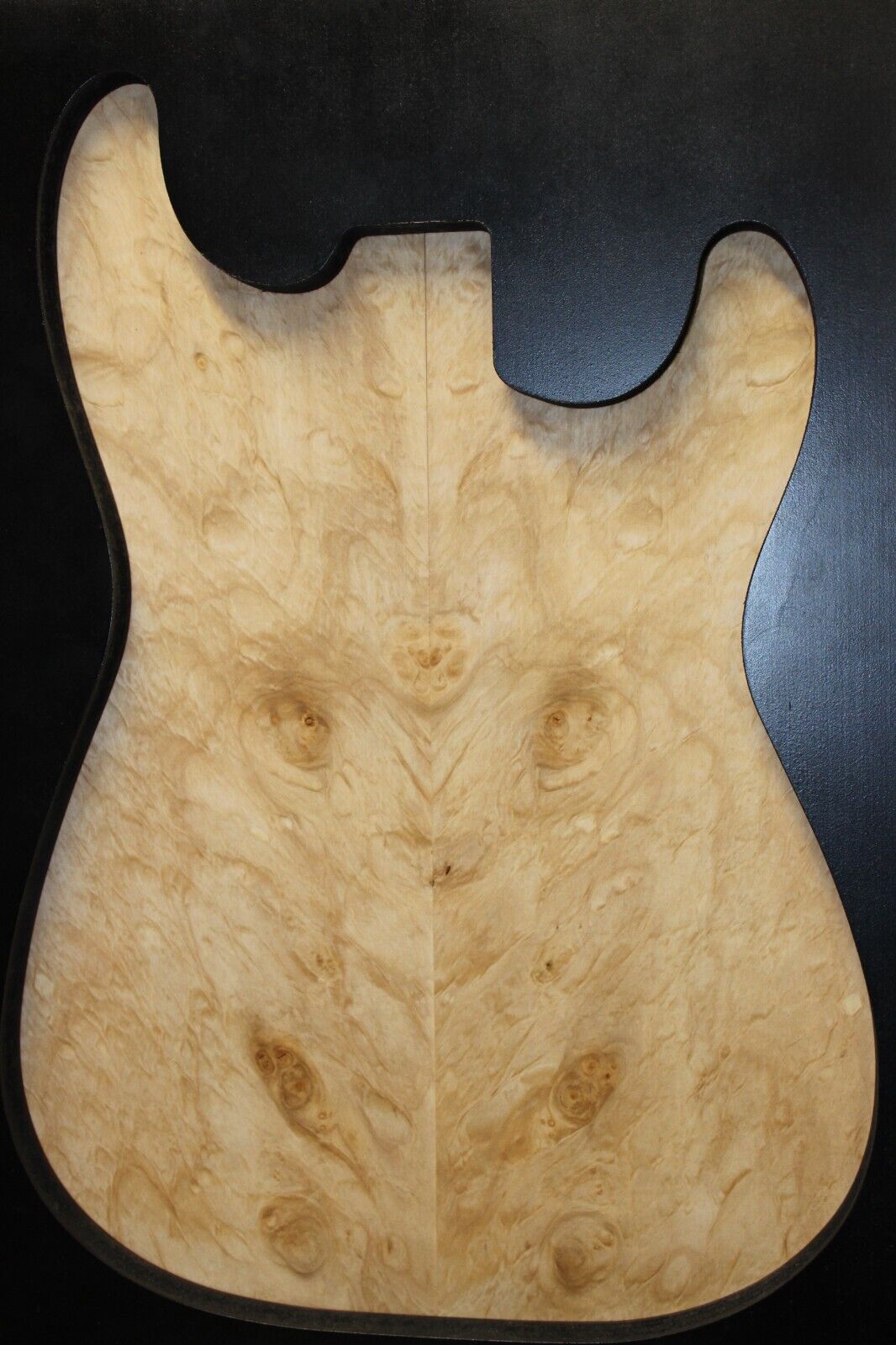 Silver maple, burl / lace figured guitar book matched top.