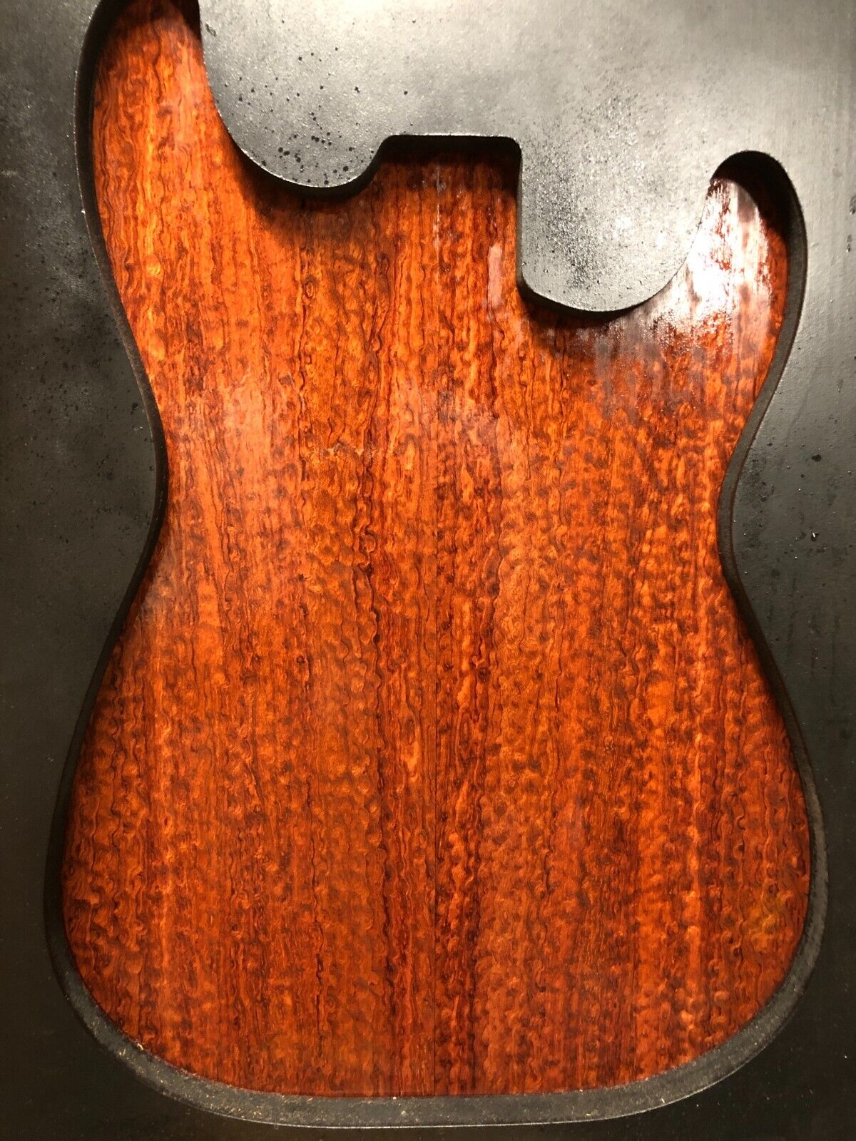 Pomelle figured bubinga electric guitar drop top.