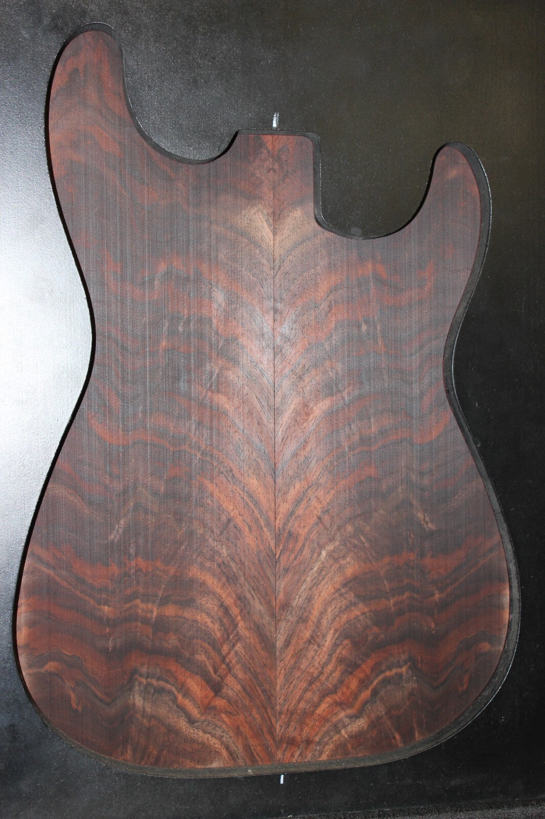 Black walnut crotch figured book matched guitar top.