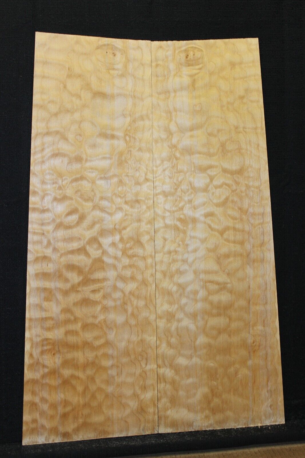 Quilted maple book matched guitar drop top.