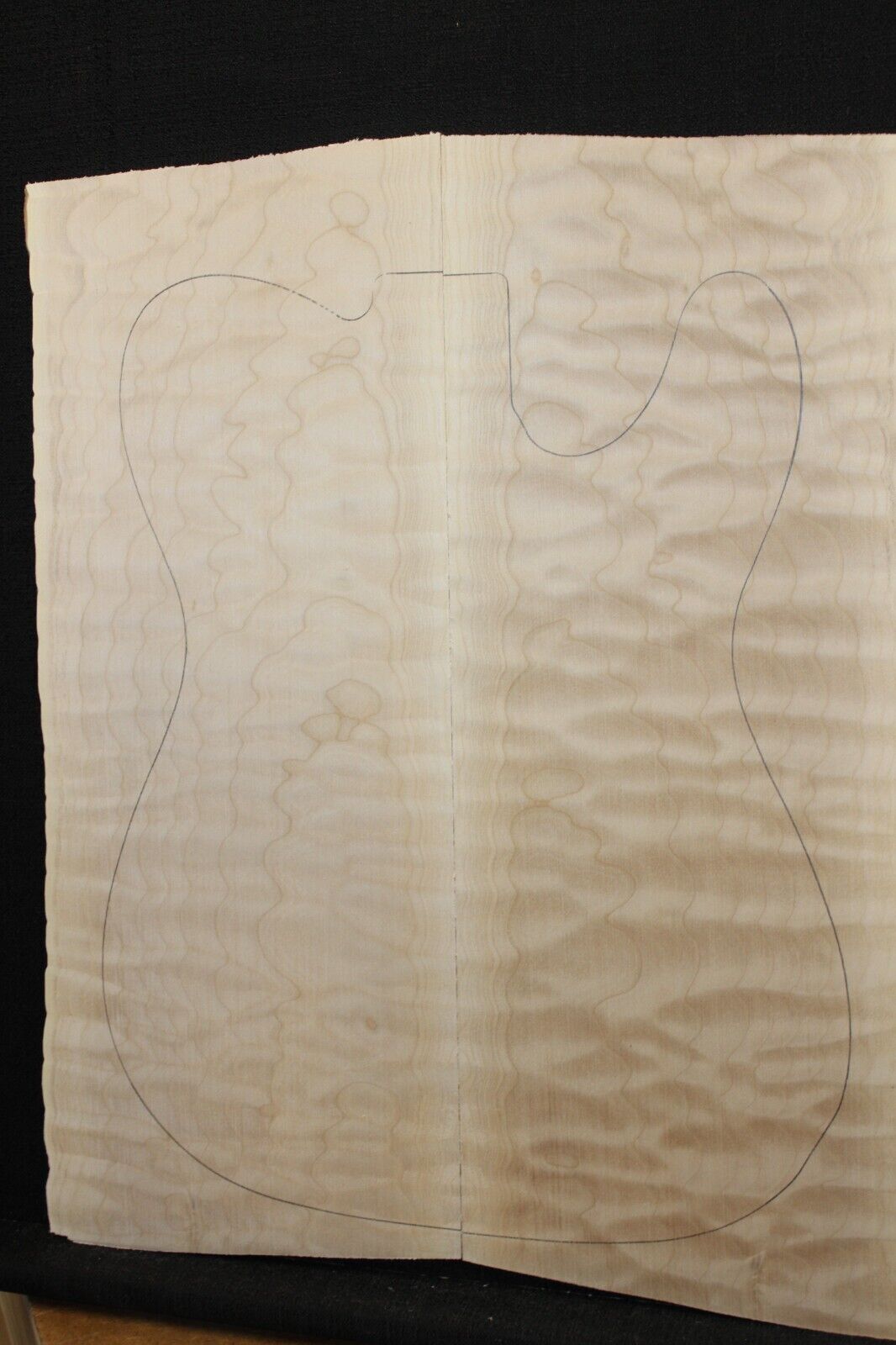 Quilted maple book matched guitar drop top. 5A figure, telly size