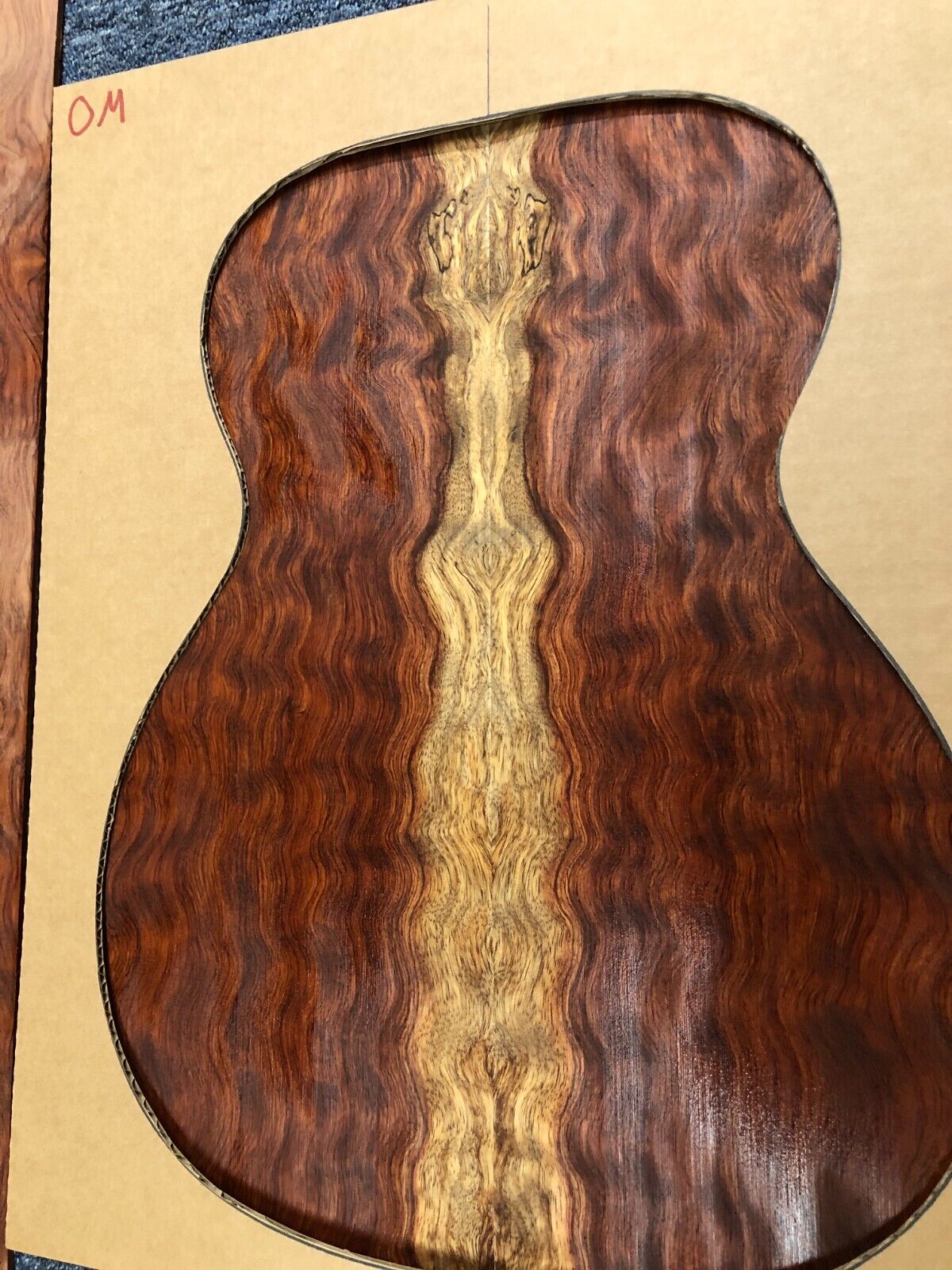 Waterfall figured bubinga back and side set. Stunning grain, color and figure.