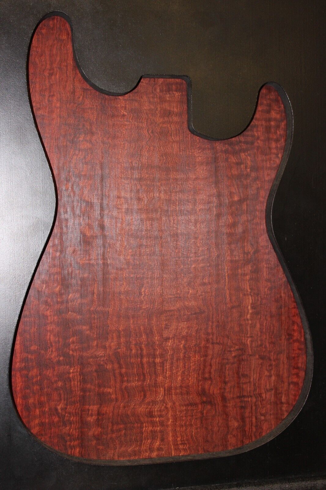 Figured bubinga electric guitar drop top. Curly / pomelle figure & rich color.