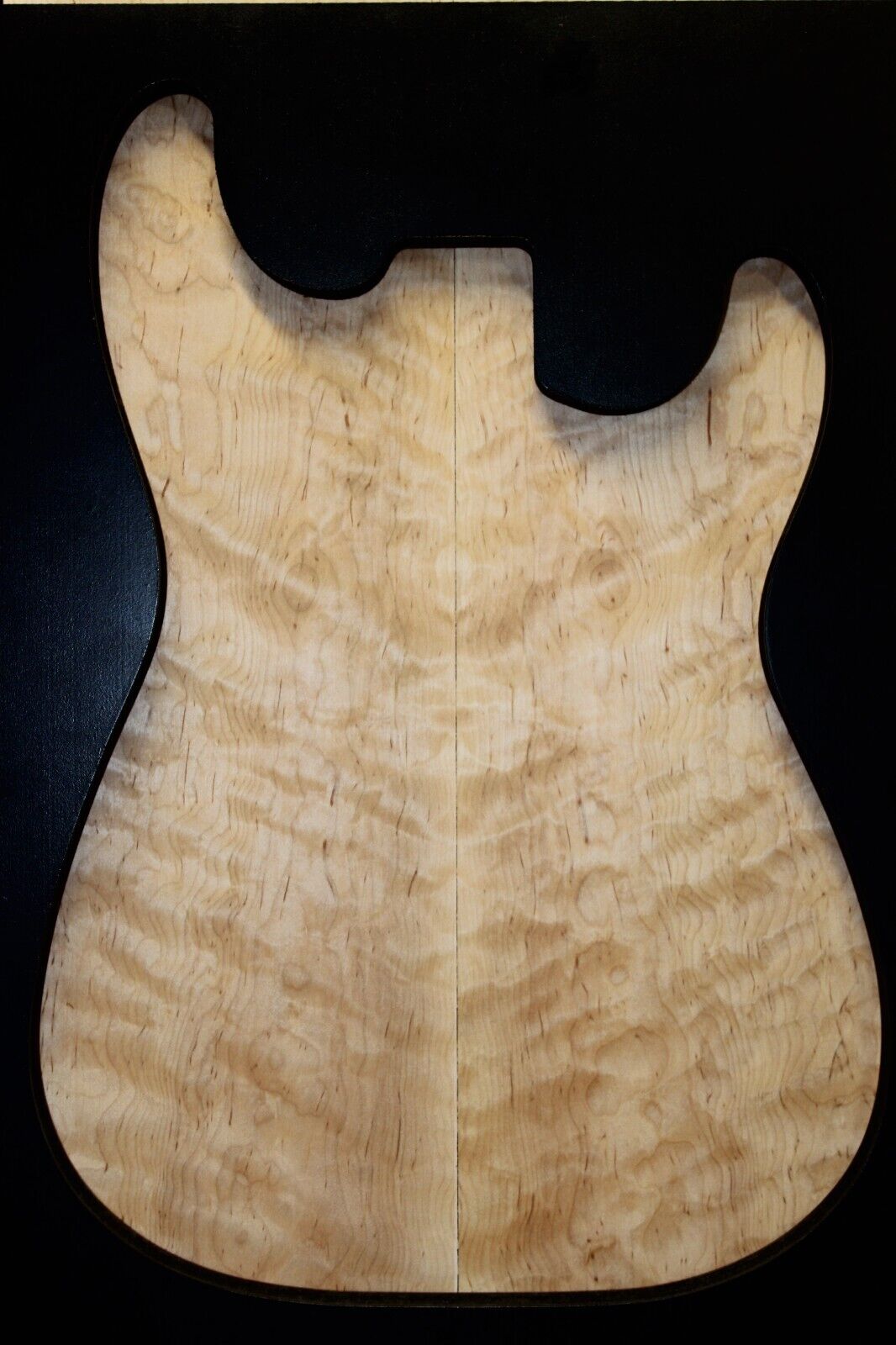 Figured eastern red maple guitar book matched top.