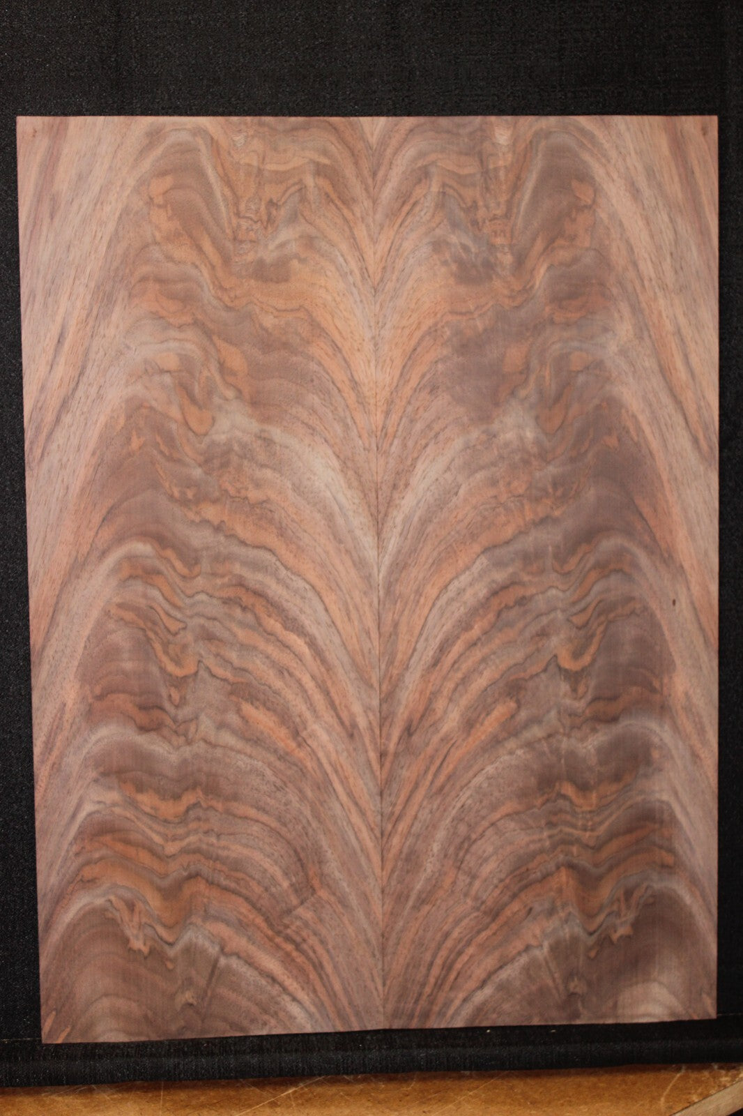 Black walnut crotch figured book matched guitar top.