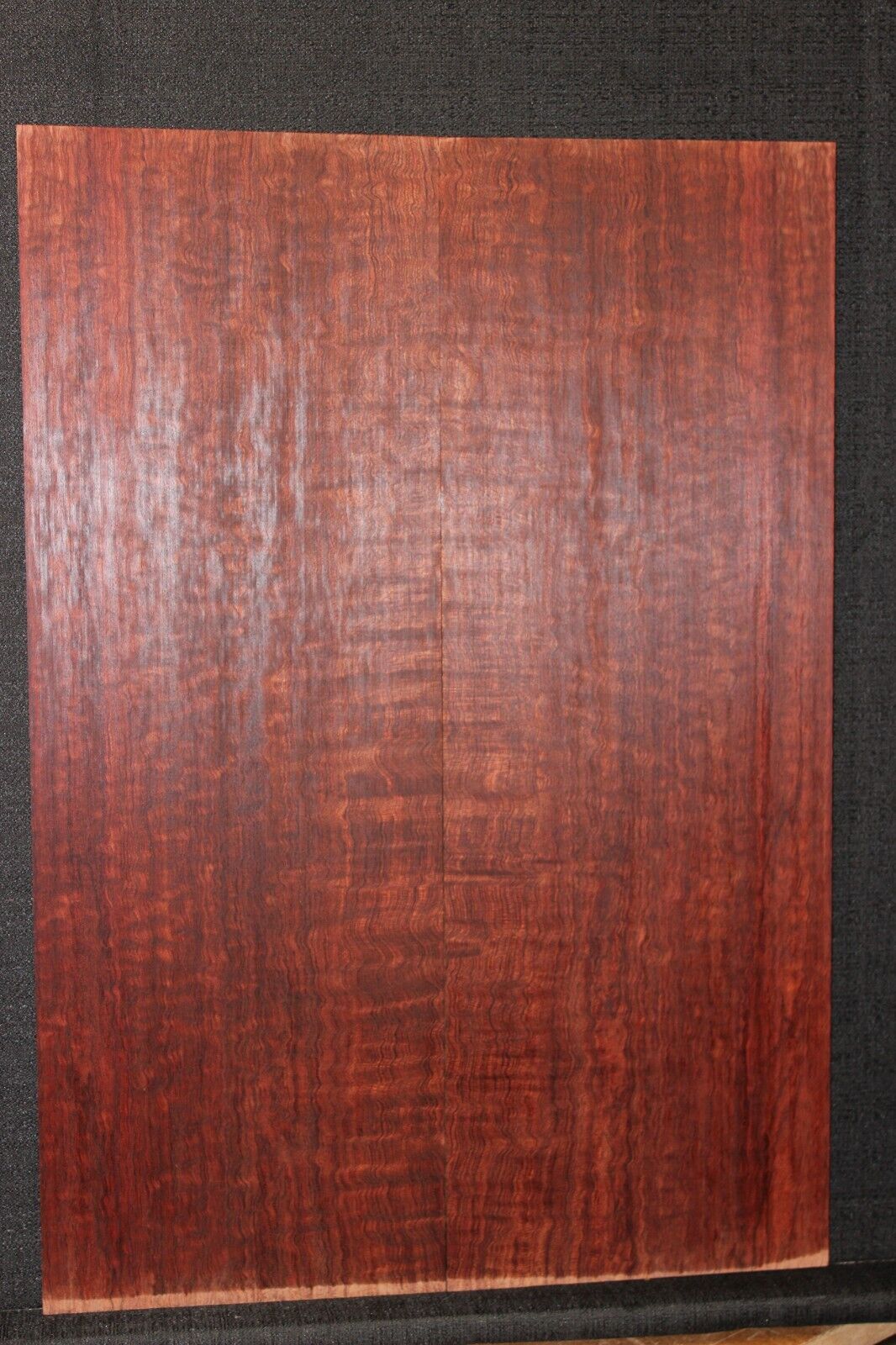 Figured bubinga electric guitar drop top. Curly / pomelle figure & rich color.