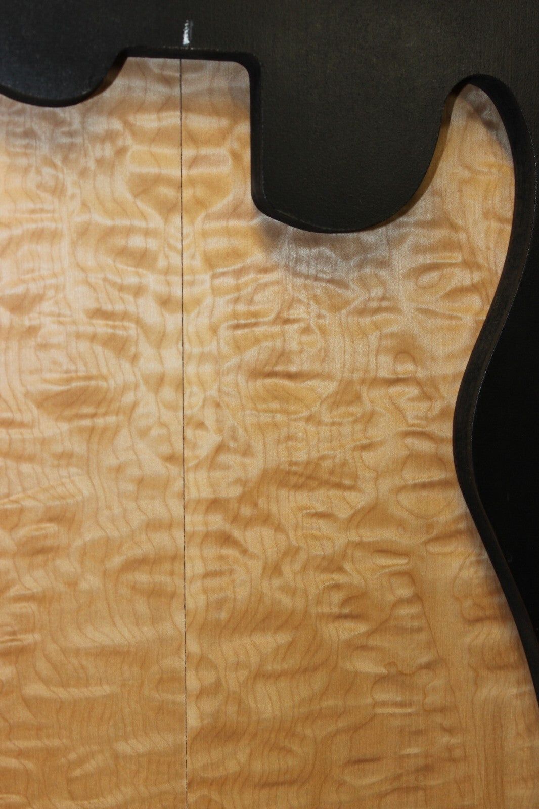 Quilted maple book matched guitar drop top.